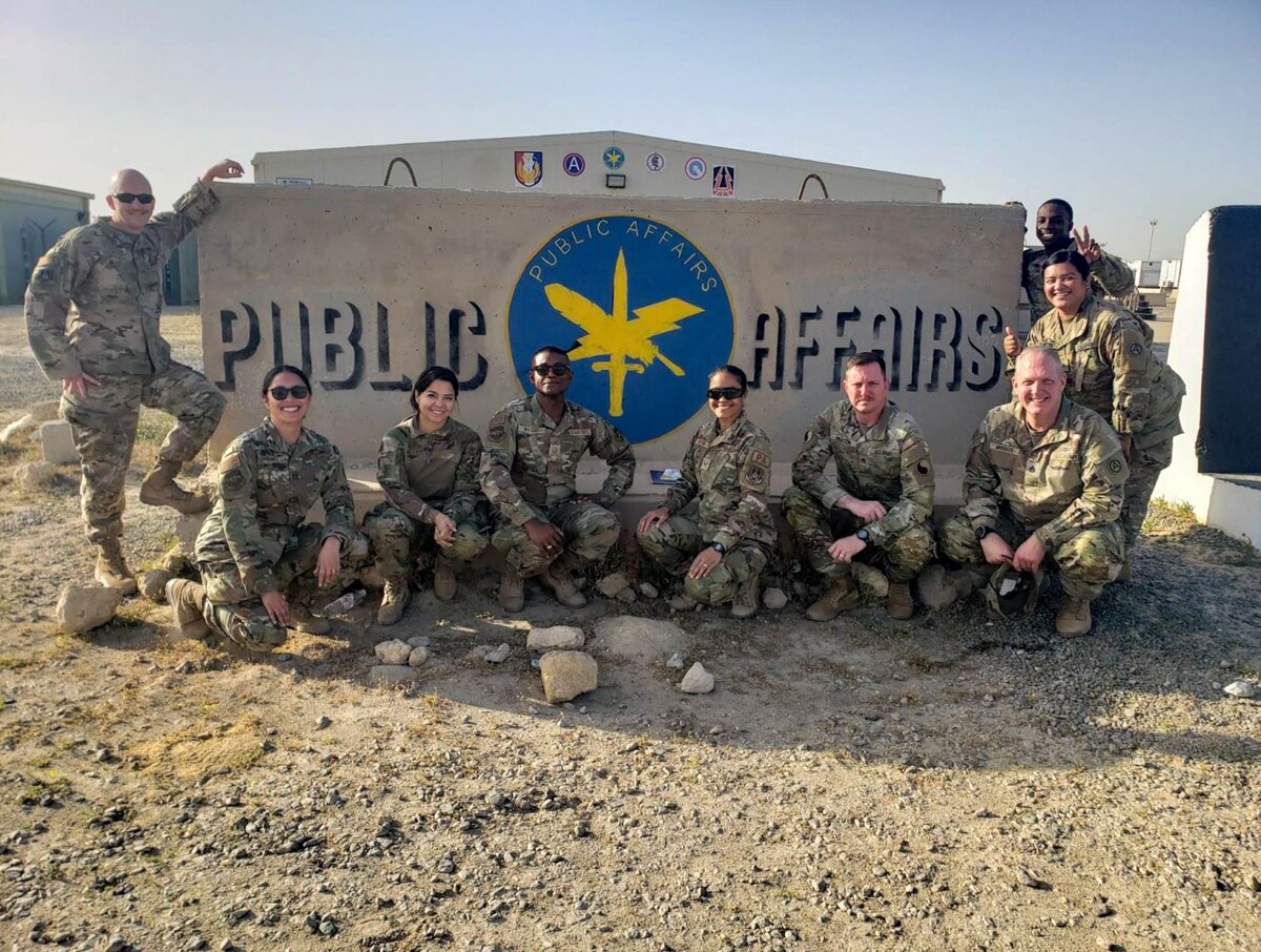 From left, U.S. Air Force Tech Sgt. Patrick Evenson, Capt. Melissa Heintz, Senior Airman Natalie Filzen, Master Sgt. Arthur Wright and Senior Airman Daira Jackson pose with members of U.S. Army Central Public Affairs at Camp Arifjan, Kuwait, March 18, 2022. The 386th Air Expeditionary Wing Public Affairs unit collaborated with the ARCENT PA team on photo shoots and events. (U.S. Air Force courtesy photo)