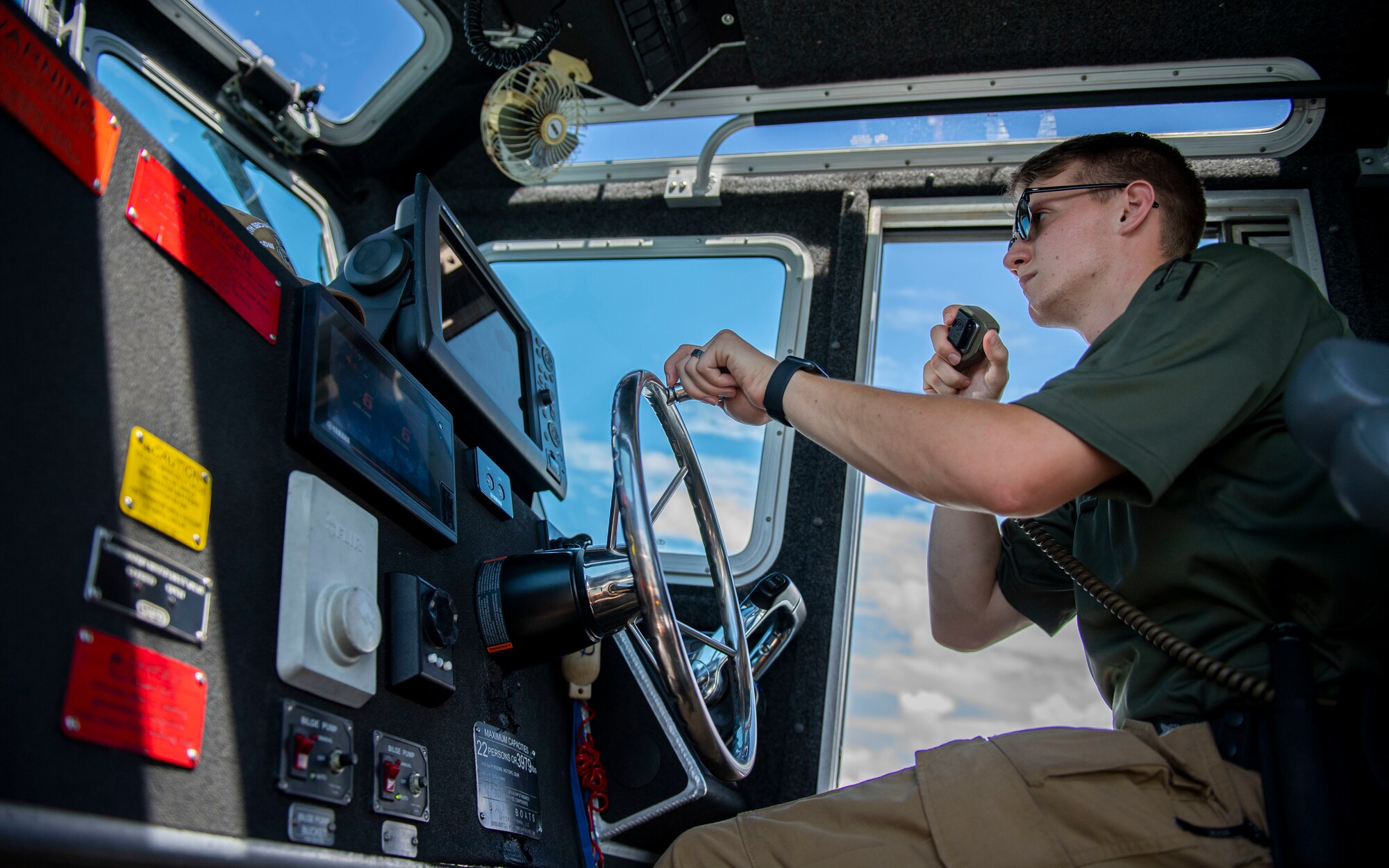 U.S. Air Force Airman 1st Class Sabin Venable, 6th Security Forces Squadron marine patrolman, operates a vessel at MacDill Air Force Base, Florida, July 10, 2022. Marine patrolmen utilize patrol boats, jet skis, and all-terrain vehicles to monitor coastal restricted areas surrounding MacDill AFB which include shallow waterways accessible only by jet ski. (U.S. Air Force photo by Airman 1st Class Lauren Cobin)