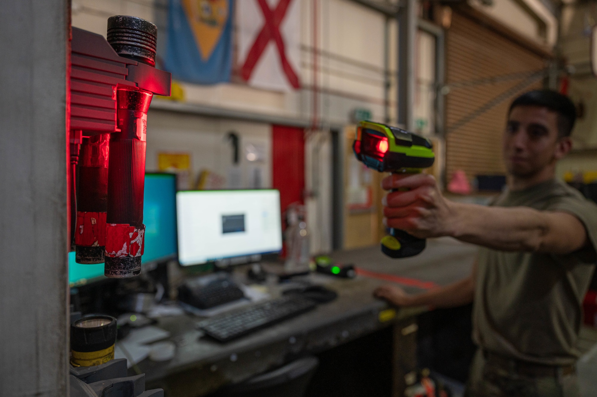U.S. Air Force Senior Airman Albert Garcia, a composite tool kit technician and crew chief with the 386th  Expeditionary Aircraft Maintenance Squadron Sortie Support Component Equipment Maintenance Flight, scans a flashlight at Ali Al Salem Air Base, June 23, 2022. Tools are often scanned and checked out of the shop by various specialty shops and coalition partners to perform maintenance on their aircraft. (U.S. Air Force photo by Senior Airman Natalie Filzen)