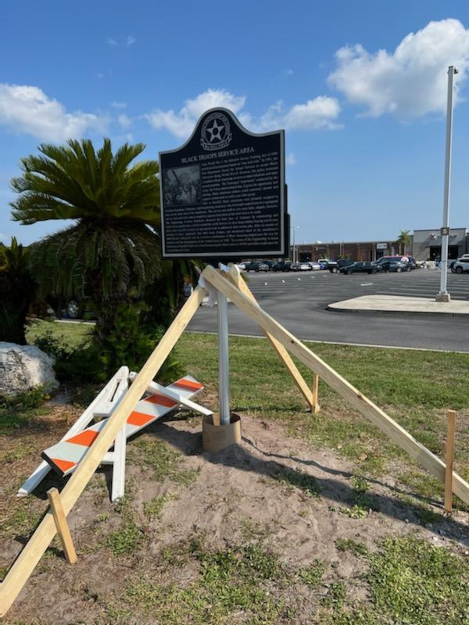 The 6th Civil Engineer Squadron prepares the site of the final marker near the once segregated facilities of the Aviation Engineers outside the MacDill Air Force Base Exchange Mall at MacDill AFB, Florida, June 26, 2022. The heritage marker formally recognizes the service of thousands of African Americans who served in engineer aviation battalions during World War II. The efforts of these battalions that trained at MacDill, expedited the end of the conflict and helped ensure an Allied victory. (U.S. Air Force photo by Master Sgt. Rickey Gray)