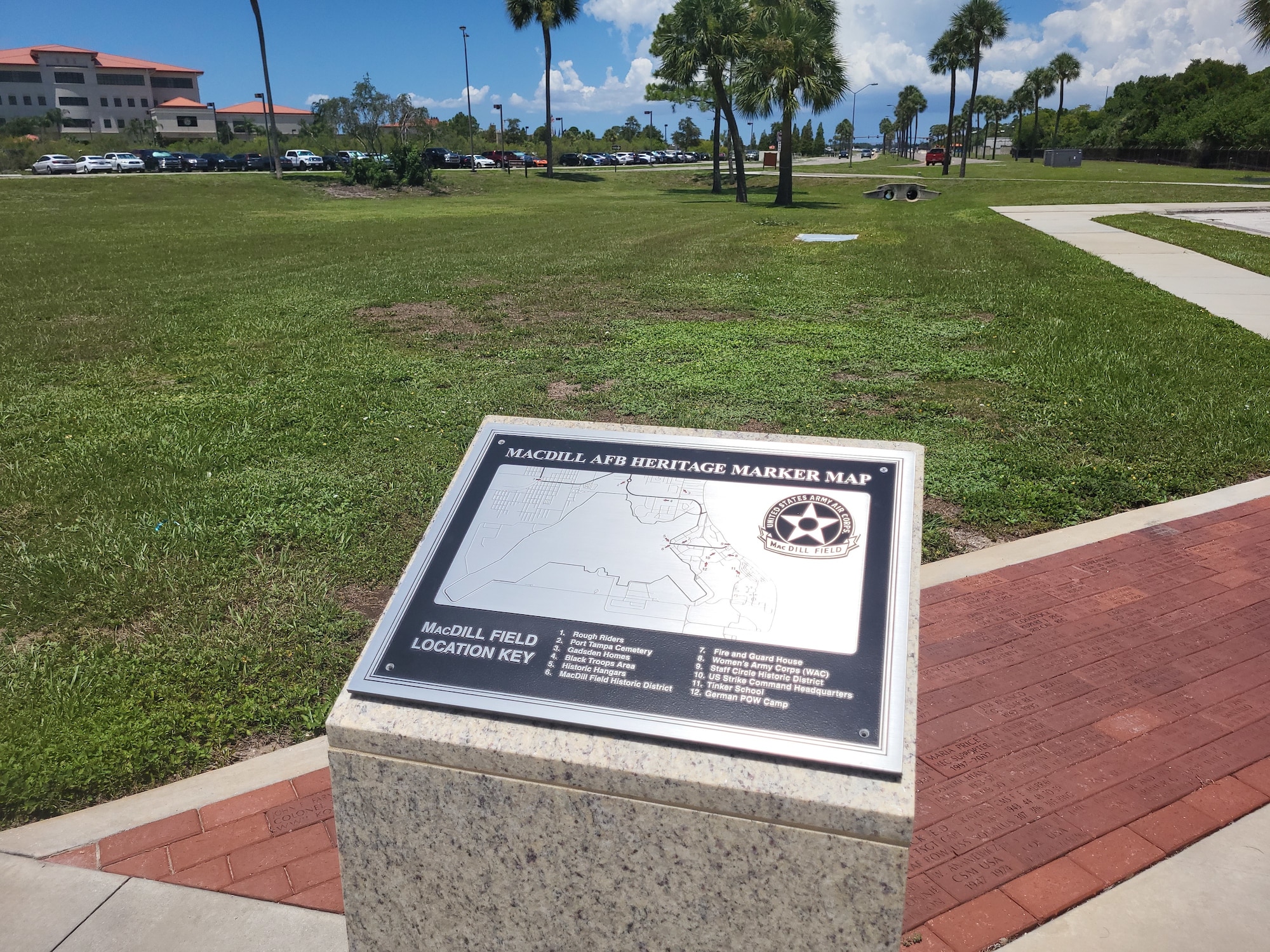 A plaque displaying a map of 12 roadside heritage marker locations greets visitors to the MacDill Community Park June 24, 2022, MacDill Air Force Base, Florida, which also now includes a new history wall, historic aircraft and unit displays, where base personnel can learn more about these groups and all eras of base history at their own pace. (U.S. Air Force photo by Stephen Ove)