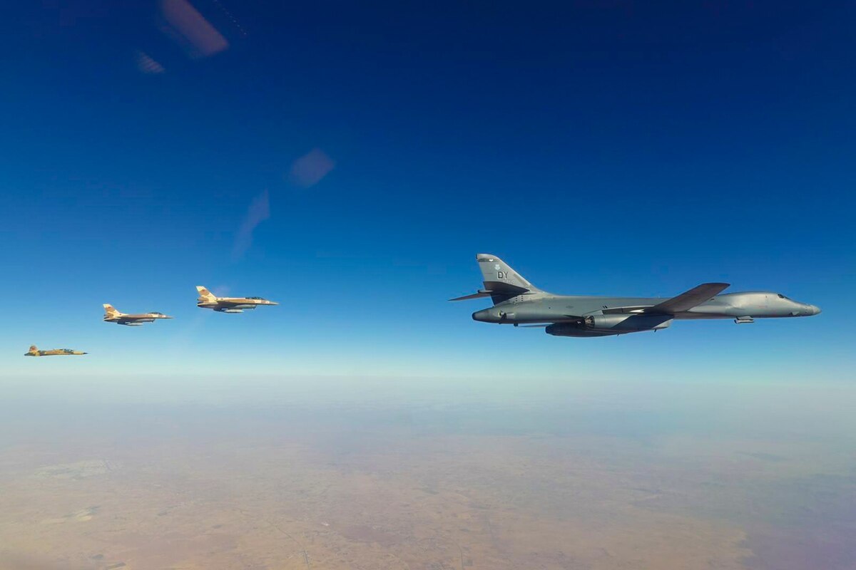 Four aircraft fly in formation.