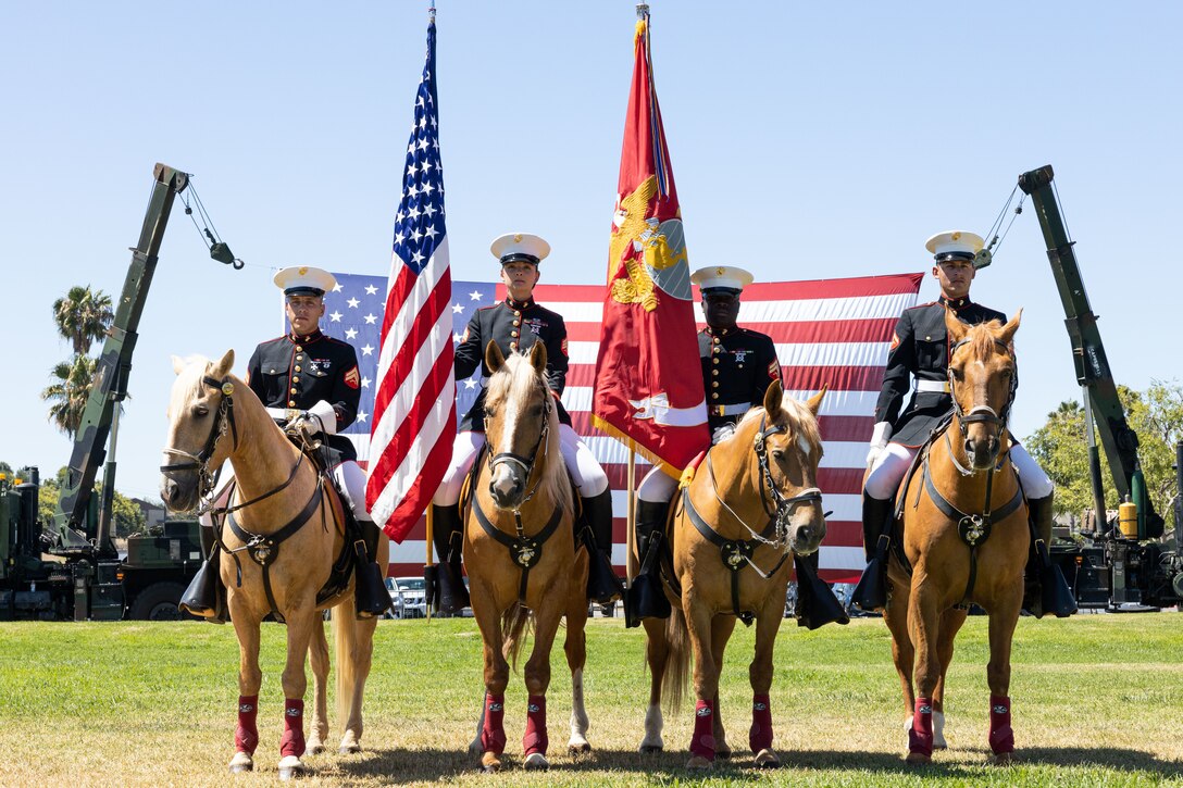 U.S. Marines from the Marine Corps Mounted Color Guard pose for a photo during 1st Network Battalion’s change of command ceremony on Marine Corps Base Camp Pendleton, California, June 24, 2022. 1st Network Bn. improves oversight, command, and control of the Marine Corps enterprise network while managing local area networks across the west coast region.