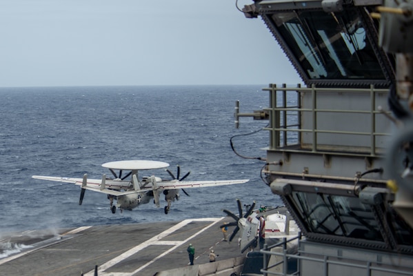 SOUTH CHINA SEA (July 13, 2022) An E-2D Hawkeye attached to the Tigertails of Airborne Early Warning Squadron (VAW) 125 launches from the flight deck of the U.S. Navy’s only forward-deployed aircraft carrier USS Ronald Reagan (CVN 76). E-2D Hawkeyes perform tactical airborne early warning missions to provide valuable information to Carrier Strike Group 5 as it plans and executes operations. Ronald Reagan, the flagship of Carrier Strike Group 5, provides a combat-ready force that protects and defends the United States, and supports alliances, partnerships and collective maritime interests in the Indo-Pacific region. (U.S. Navy photo by Mass Communication Specialist 3rd Class Gray Gibson)