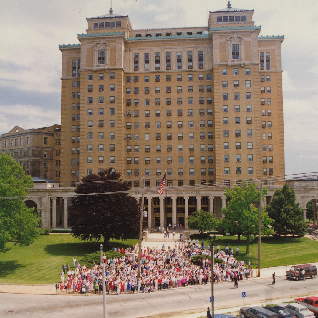 Aerial photo of people in front of building.