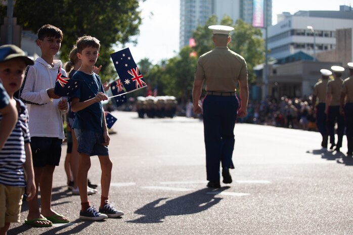 Children from Darwin, NT, Australia, watch U.S. Marines with Marine Rotational Force-Darwin (MRF-D)  22, march in a parade during the 107th Commemorative Service in honor of Australian and New Zealand Army Corps (ANZAC) Day on April 25, 2022. U.S. Marines with MRF-D 22 participated in Anzac Day ceremonies and celebrations to commemorate the first major military action fought by Australian and New Zealand forces during the First World War, and to join in recognition of the sacrifices and service of the ANZAC forces.