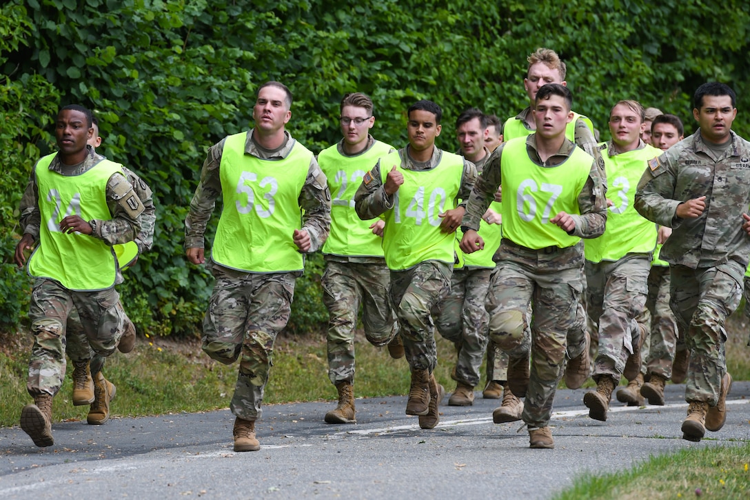 A large group of soldiers run together.