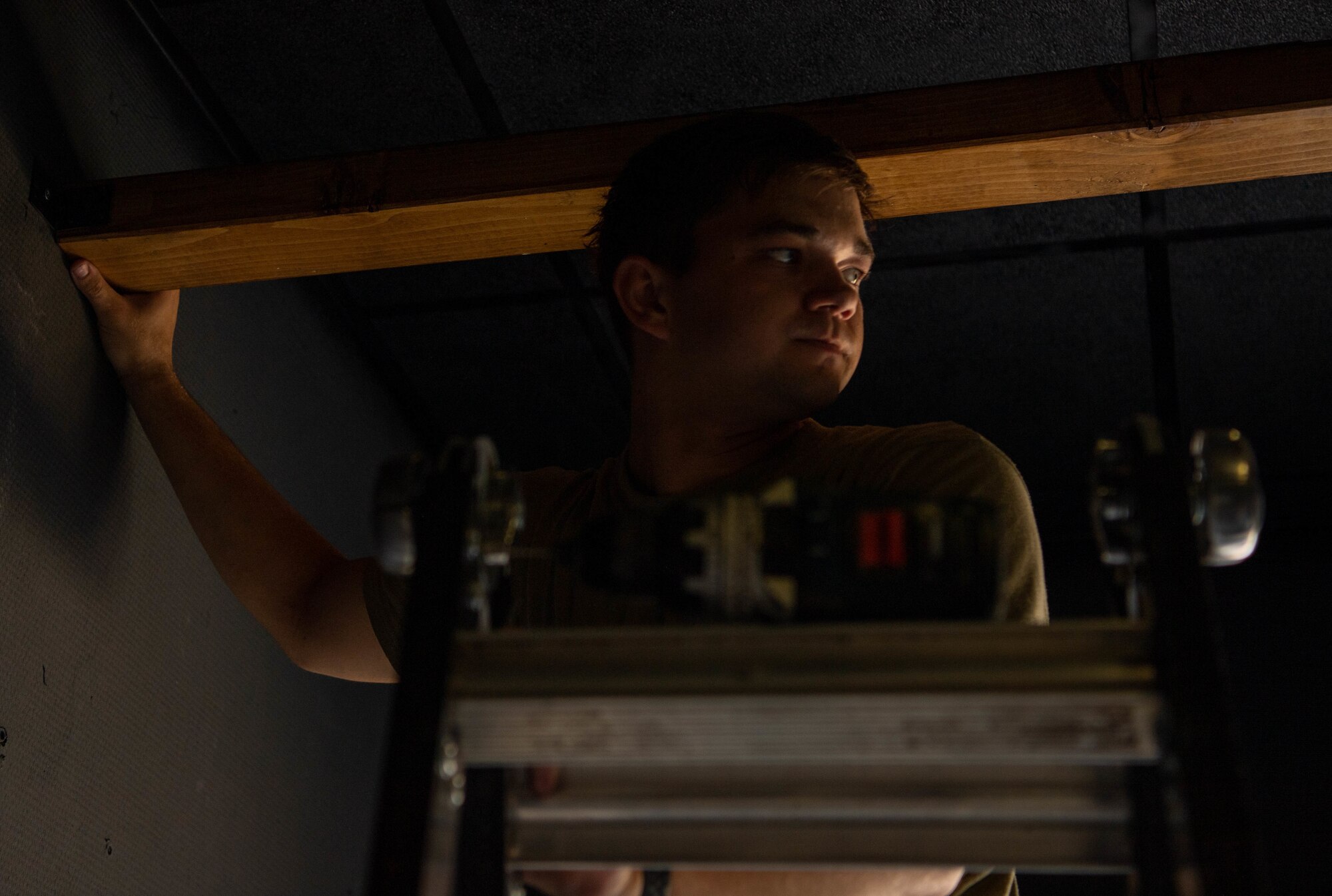 A U.S. Air Force Airmen, assigned to Ramstein Air Base, Germany, works on the construction of the Den at Ramstein Air Base, Germany, May 25, 2022.
