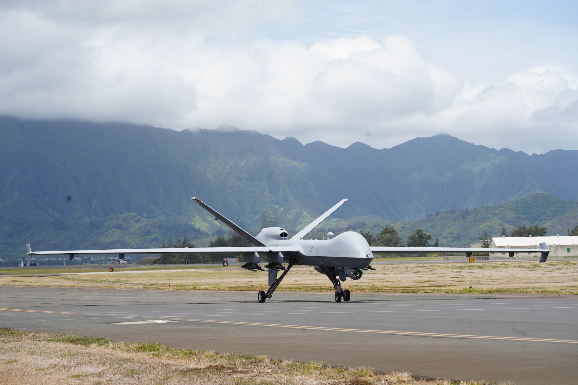 220706-F-IU083-1223 KANEOHE BAY, Hawaii (July 6, 2022) - A U.S. Air Force MQ-9 Reaper assigned to the 49th Wing taxis down a runway at Marine Corps Air Station Kaneohe Bay, Hawaii, during Rim of the Pacific (RIMPAC) 2022. Unmanned and remotely operated vessels extend the capability of interconnected manned platform sensors to enhance the warfighting capacity of multinational joint task forces. Twenty-six nations, 38 ships, four submarines, more than 170 aircraft and 25,000 personnel are participating in RIMPAC from June 29 to Aug. 4 in and around the Hawaiian Islands and Southern California. The world's largest international maritime exercise, RIMPAC provides a unique training opportunity while fostering and sustaining cooperative relationships among participants critical to ensuring the safety of sea lanes and security on the world's oceans. RIMPAC 2022 is the 28th exercise in the series that began in 1971. (U.S. Air Force photo by Airman 1st Class Ariel O'Shea)