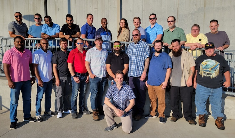 group of people posing for photo at caven point marine terminal