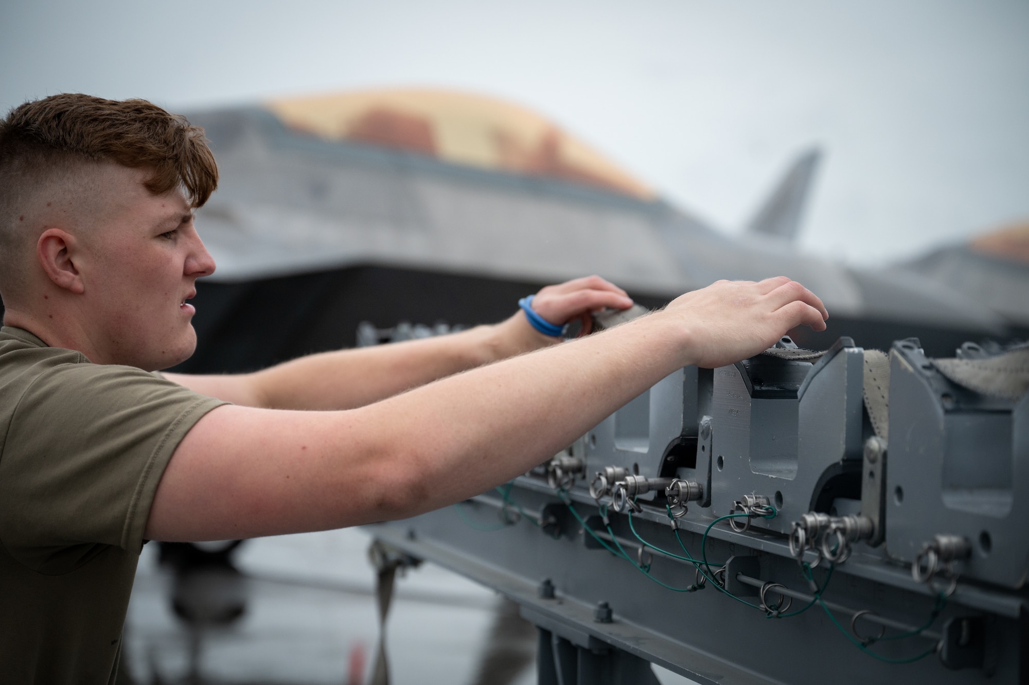 A photo of a U.S. Airman competing in the 3rd Wing load competition