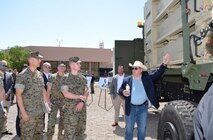 Program Executive Officer Land Systems Ground-Based Air Defense Program Manager, Don Kelley, shows the expeditionary launcher of the Medium-Range Intercept Capability prototype to Marine Corps senior leaders following a successful test demonstration of the system at White Sands Missile Range, New Mexico, June 30, 2022. The MRIC prototype is the Marine Corps’ proposed new counter-cruise missile capability. During the test, the MRIC prototype successfully hit several simultaneously-launched cruise missile targets. (U.S. Army photo by John Hamilton)