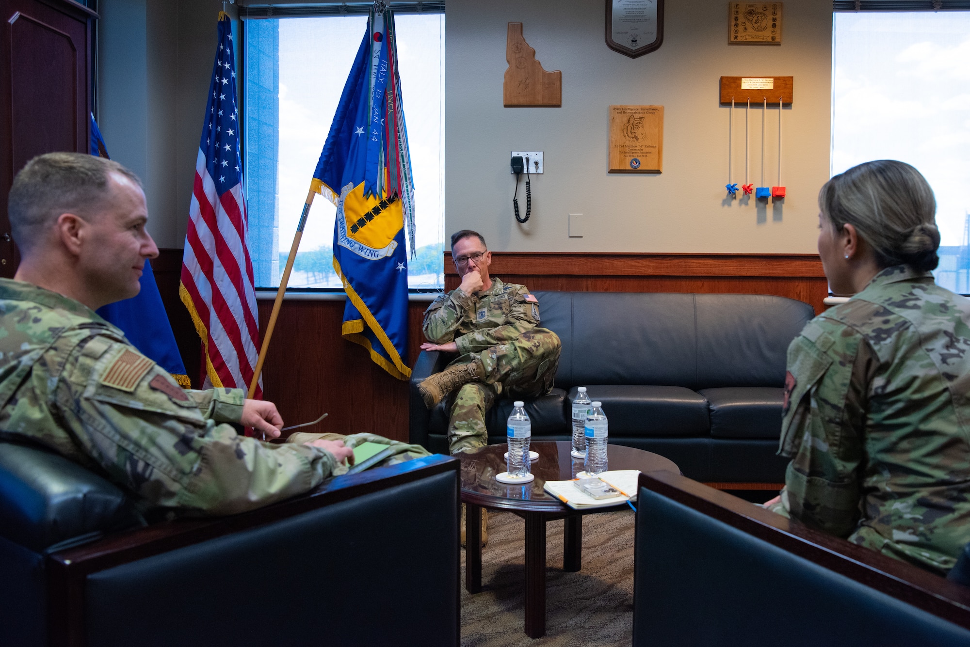 Chief Master Sergeant of the Space Force Roger A. Towberman sits in a briefing with Col. Christopher Corbett, 17th Training Wing vice commander, and Chief Master Sergeant Rebecca Arbona, 17th Training Wing command chief, at Goodfellow Air Force Base, Texas, July 8, 2022. Towberman expressed his appreciation for the wing’s contribution to Space Force intelligence training. (U.S. Air Force photo by Senior Airman Michael Bowman)