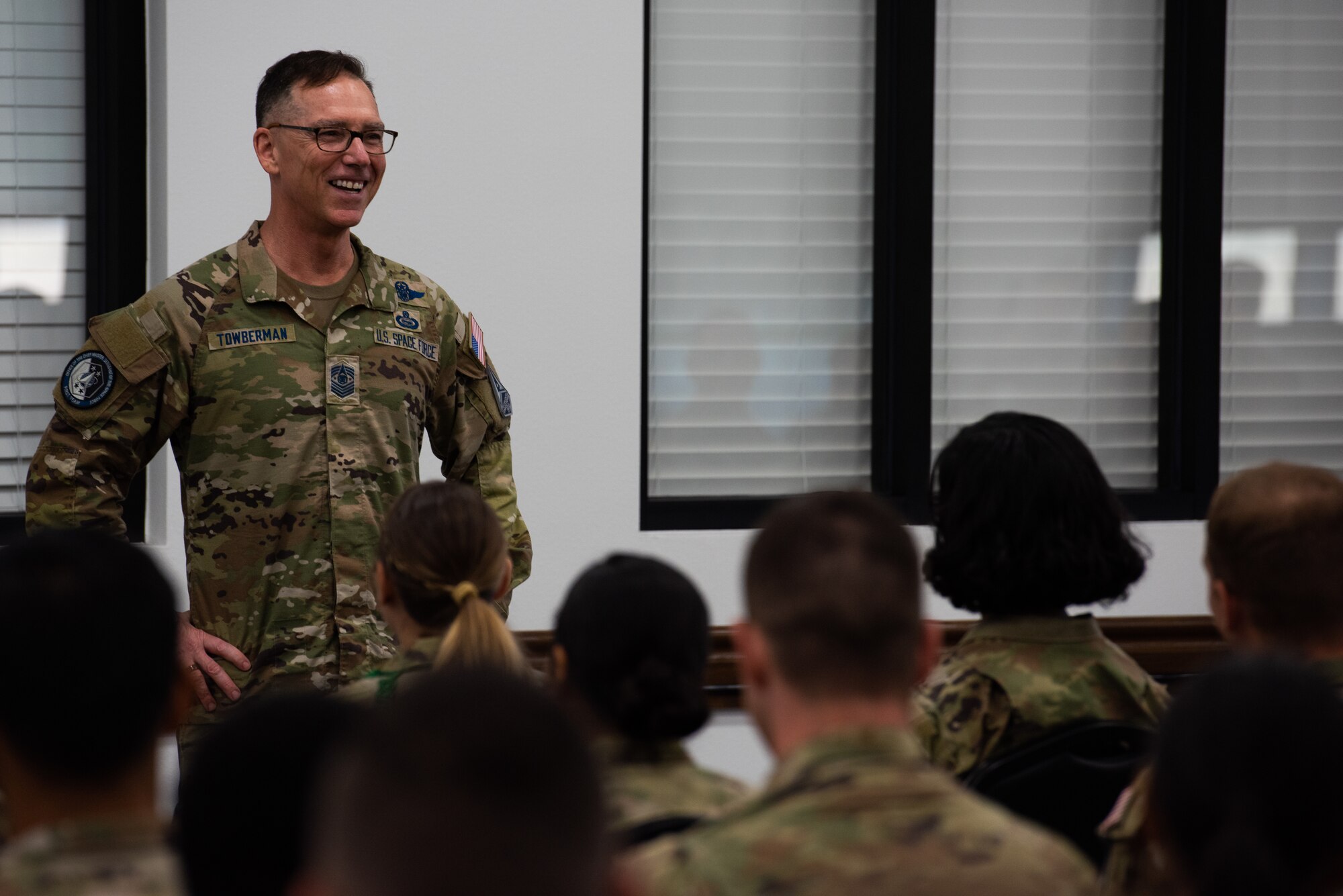 Chief Master Sergeant of the Space Force Roger A. Towberman smiles while listening to a question from students during a question and answer session at Goodfellow Air Force Base, Texas, July 8, 2022. Chief Towberman fielded questions from the students on topics related to the future of Space Force operations. (U.S. Air Force photo by Senior Airman Michael Bowman)