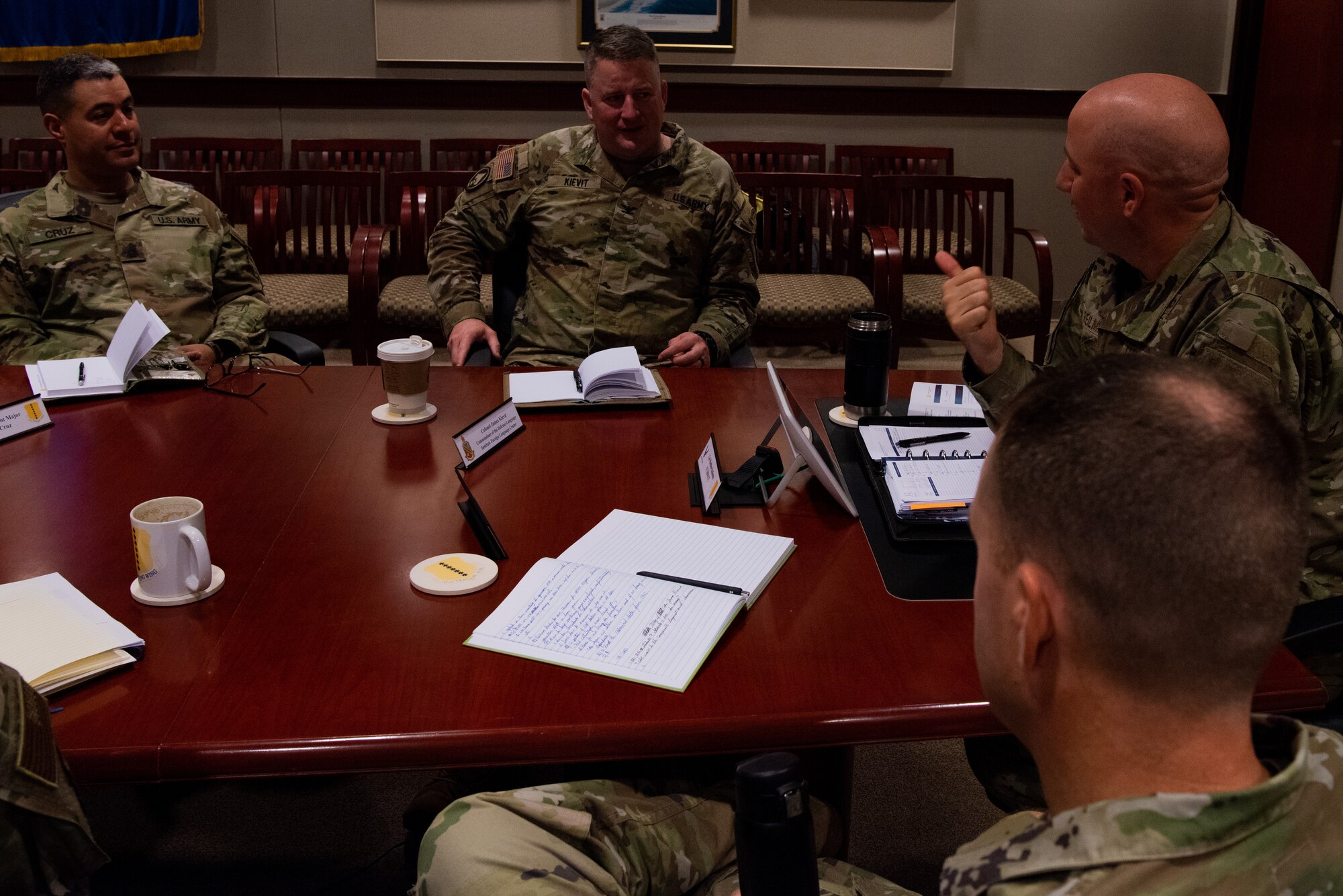 U.S. Air Force Col. Matthew “4” Reilman, 17th Training Wing commander speaks with U.S. Army Col. James A. Kievit, Defense Language Institute Foreign Language Center commandant, and Command Sergeant Major Ernesto Cruz, CSM DLIFLC, to discuss cryptologic linguist training throughout the wing, Goodfellow Air Force Base, Texas, July 12, 2022. Reilman expressed his desire to further the joint training between the 517th Training Group and DLIFLC. (U.S. Air Force photo by Senior Airman Michael Bowman)