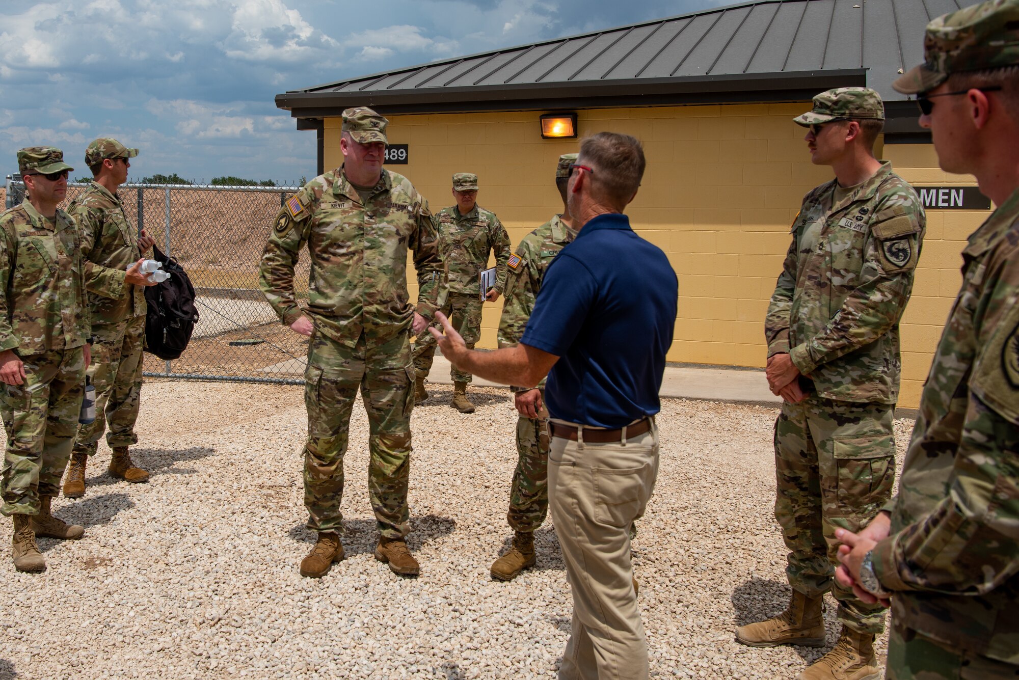 U.S. Army Col. James A. Kievit, Defense Language Institute Foreign Language Center commandant, receives a brief from members of the 344th Military Intelligence Battalion at Forward Operating Base Sentinel, Goodfellow Air Force Base, Texas, July 12, 2022. The 344th MI BN trains Soldiers to be intelligence and cyber professionals operating across the globe. (U.S. Air Force photo by Senior Airman Michael Bowman)