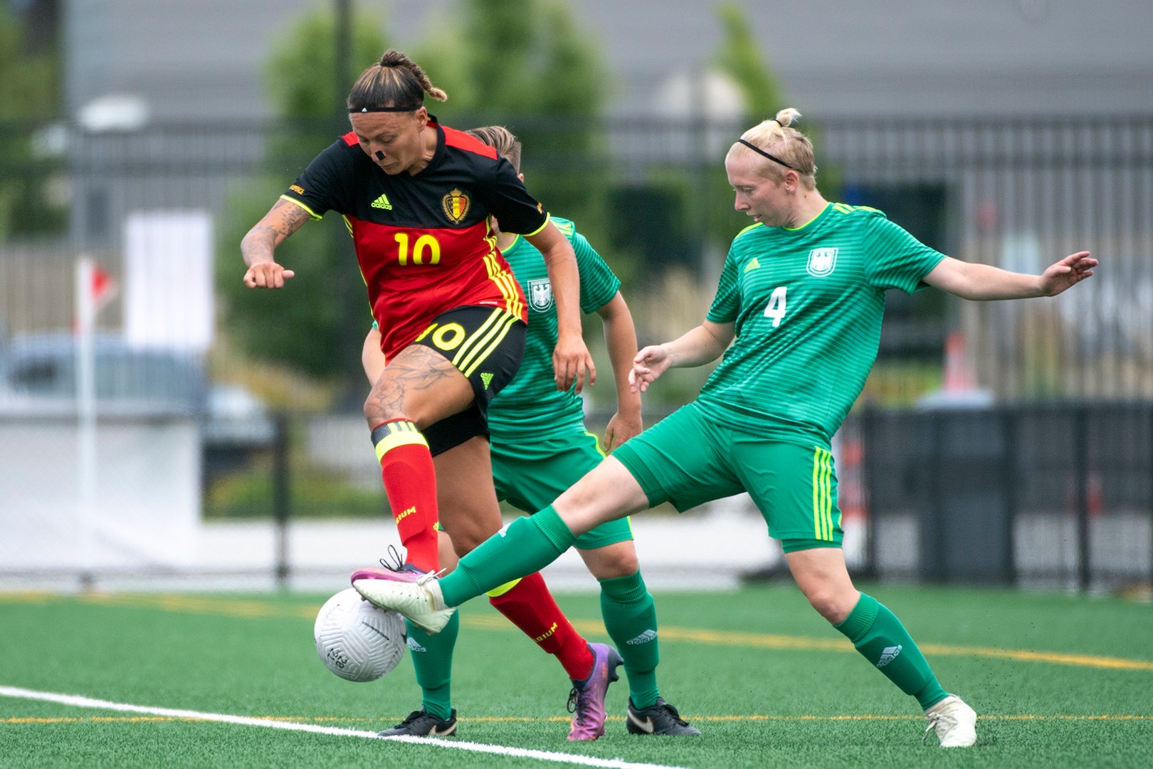 Germany’s Alexandra De Lucia, right, battles for a ball with Belgium’s Delphine Fraipont during the 13th CISM (International Military Sports Council) World Military Women’s Football Championship in Meade, Washington July 13, 2022. (DoD photo by EJ Hersom)