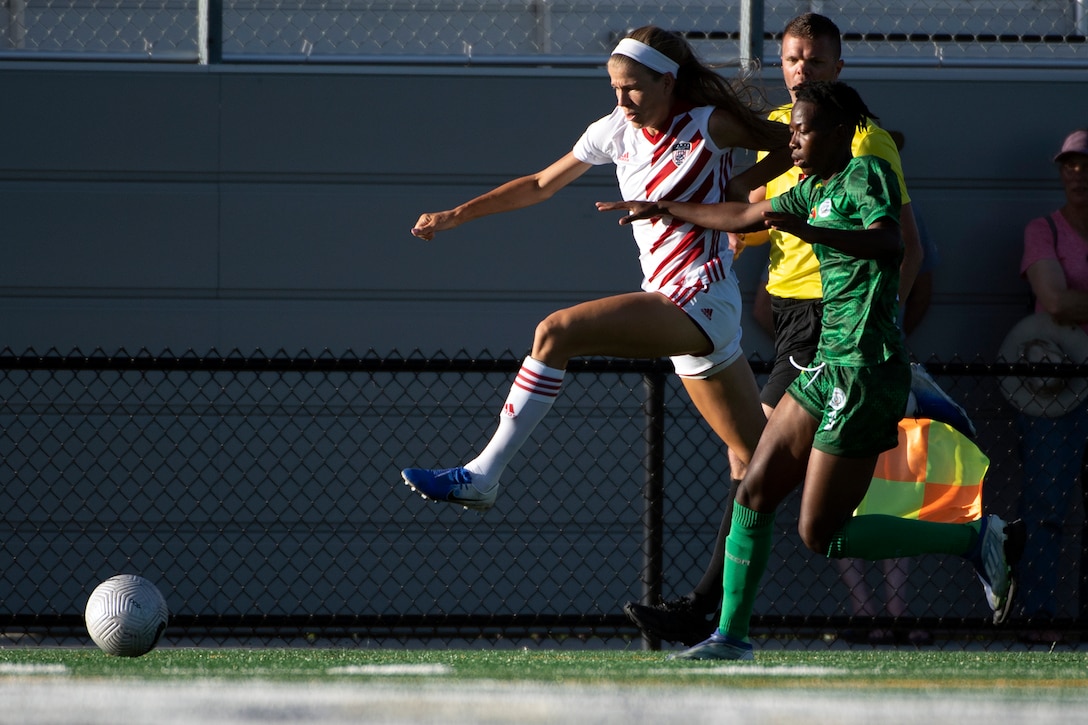 U.S. Air Force Capt. Morgan Roberts races to the ball against Cameroon’s Ambessegue Bakendj during the 13th CISM (International Military Sports Council) World Military Women’s Football Championship in Meade, Washington July 13, 2022. (DoD photo by EJ Hersom)