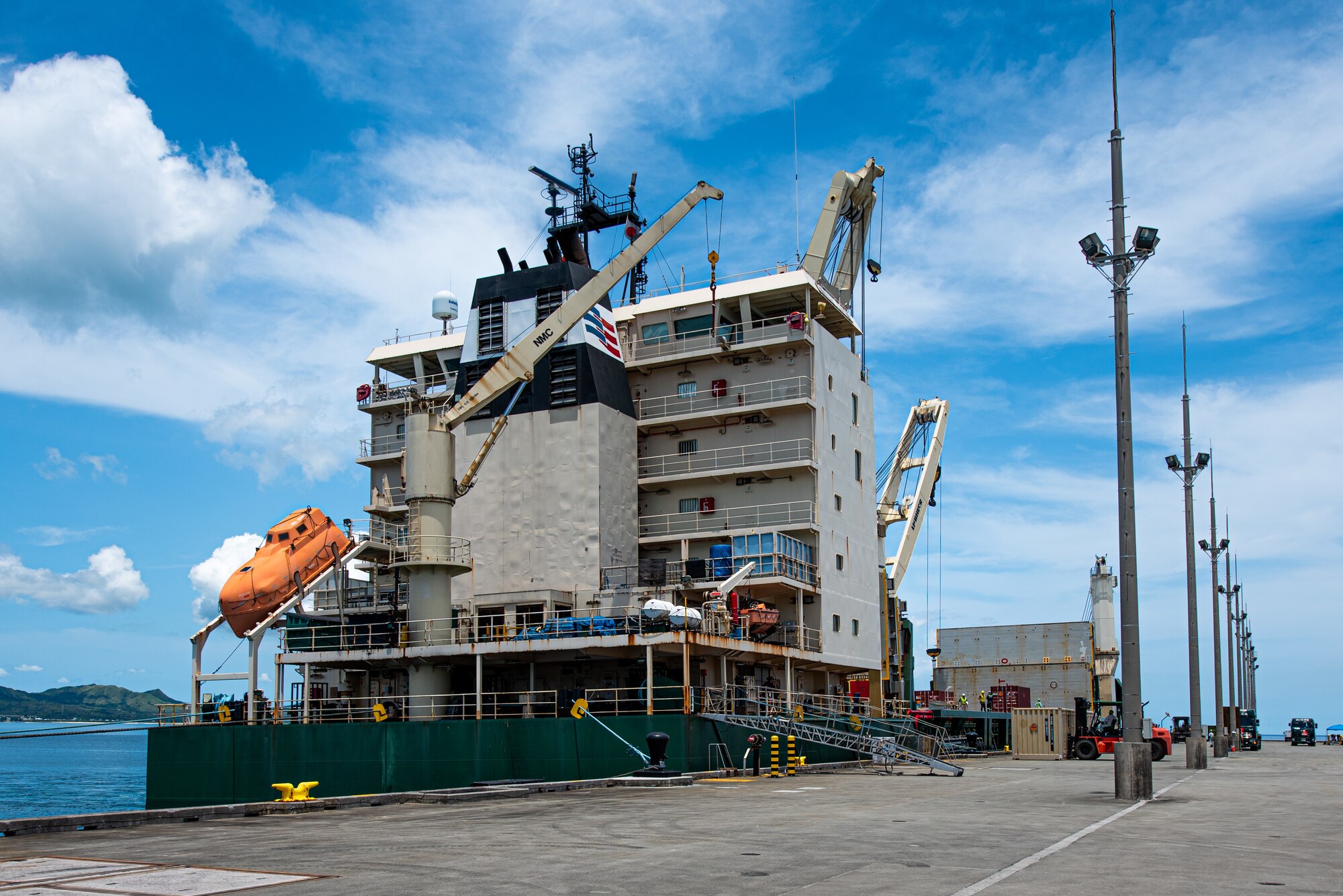 A cargo ship prepares to transport munitions.