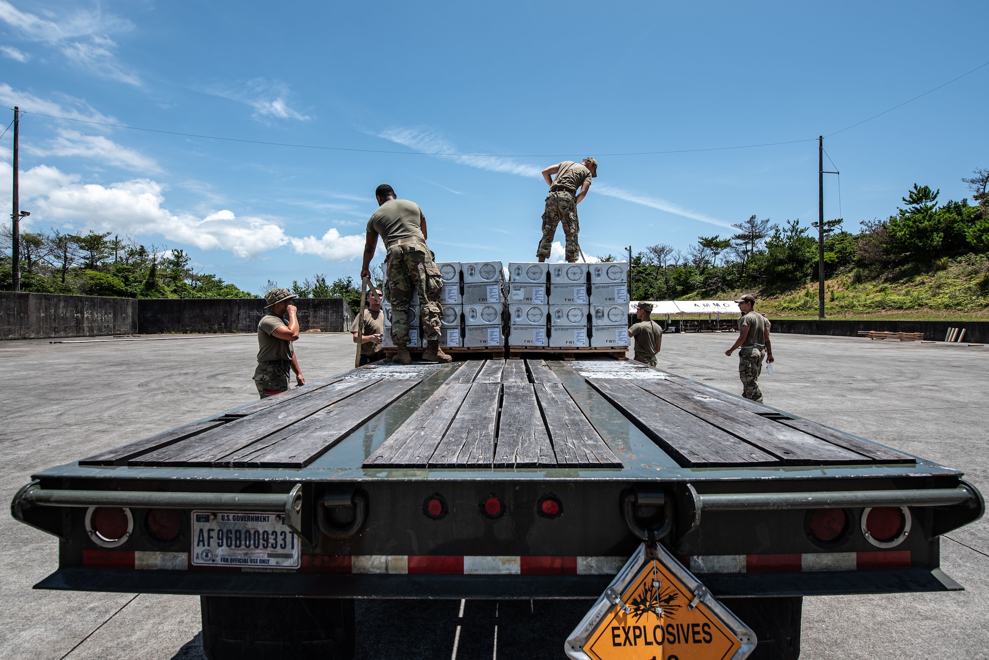 Airmen prepare a truck with munitions.