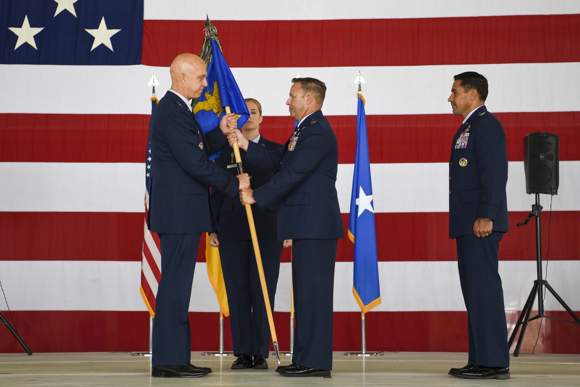 U.S. Air Force Col. Anthony M. Nance, 86th Maintenance Group outgoing commander, right, relinquishes command of the 86 MXG to Brig. Gen. Josh Olson, 86th Airlift Wing commander, during the 86 MXG change of command ceremony at Ramstein Air Base, Germany, July 13, 2022
