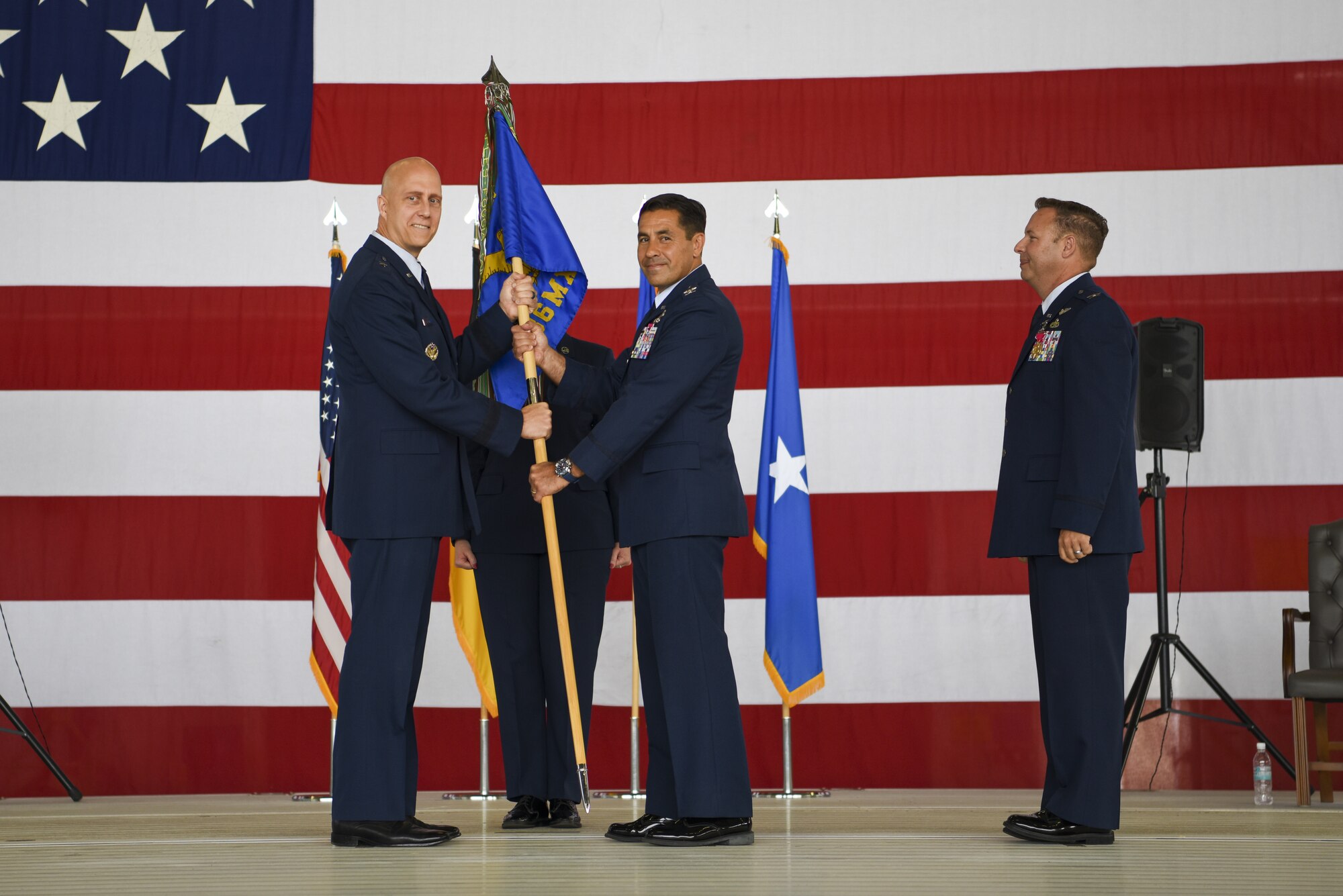 U.S. Air Force Col. Robert B. Blake, middle, assumes command of the 86th Maintenance Group from Brig. Gen. Josh Olson, 86th Airlift Wing commander, left, during a change of command ceremony at Ramstein Air Base, Germany, July 13, 2022.