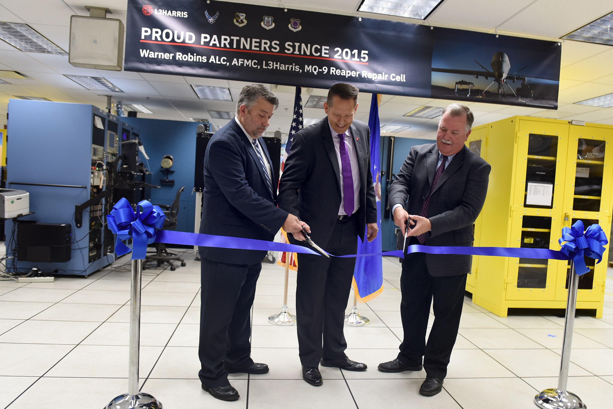 people cutting ribbon