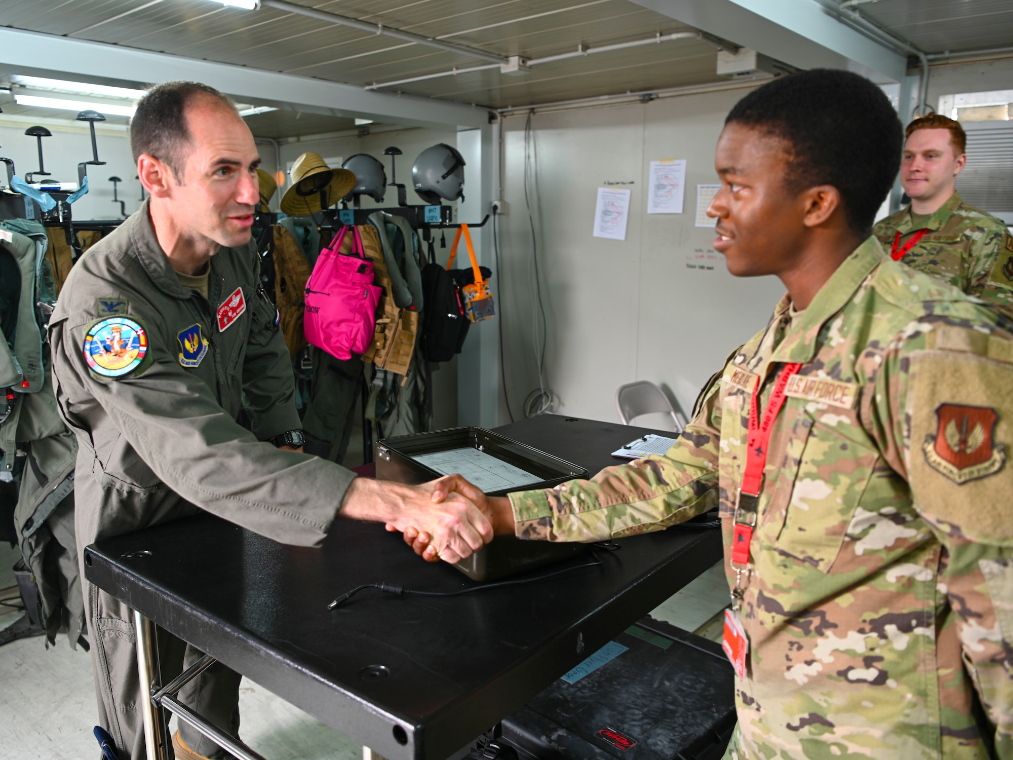 Col. Graham greets Amn Mercure