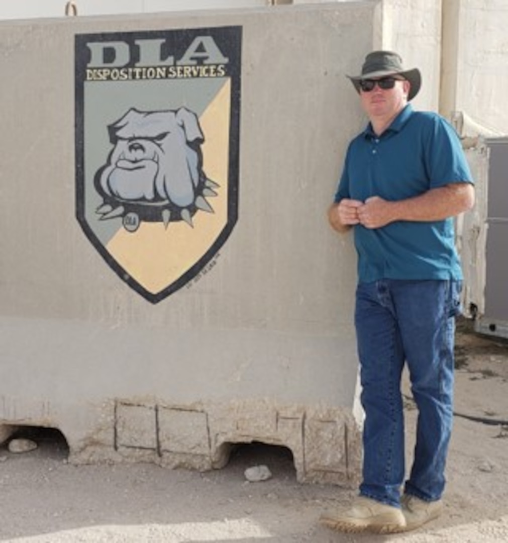 Man posing near wall