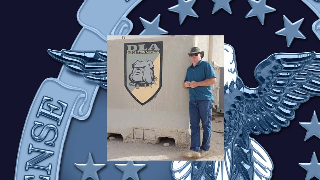 Man posing near wall