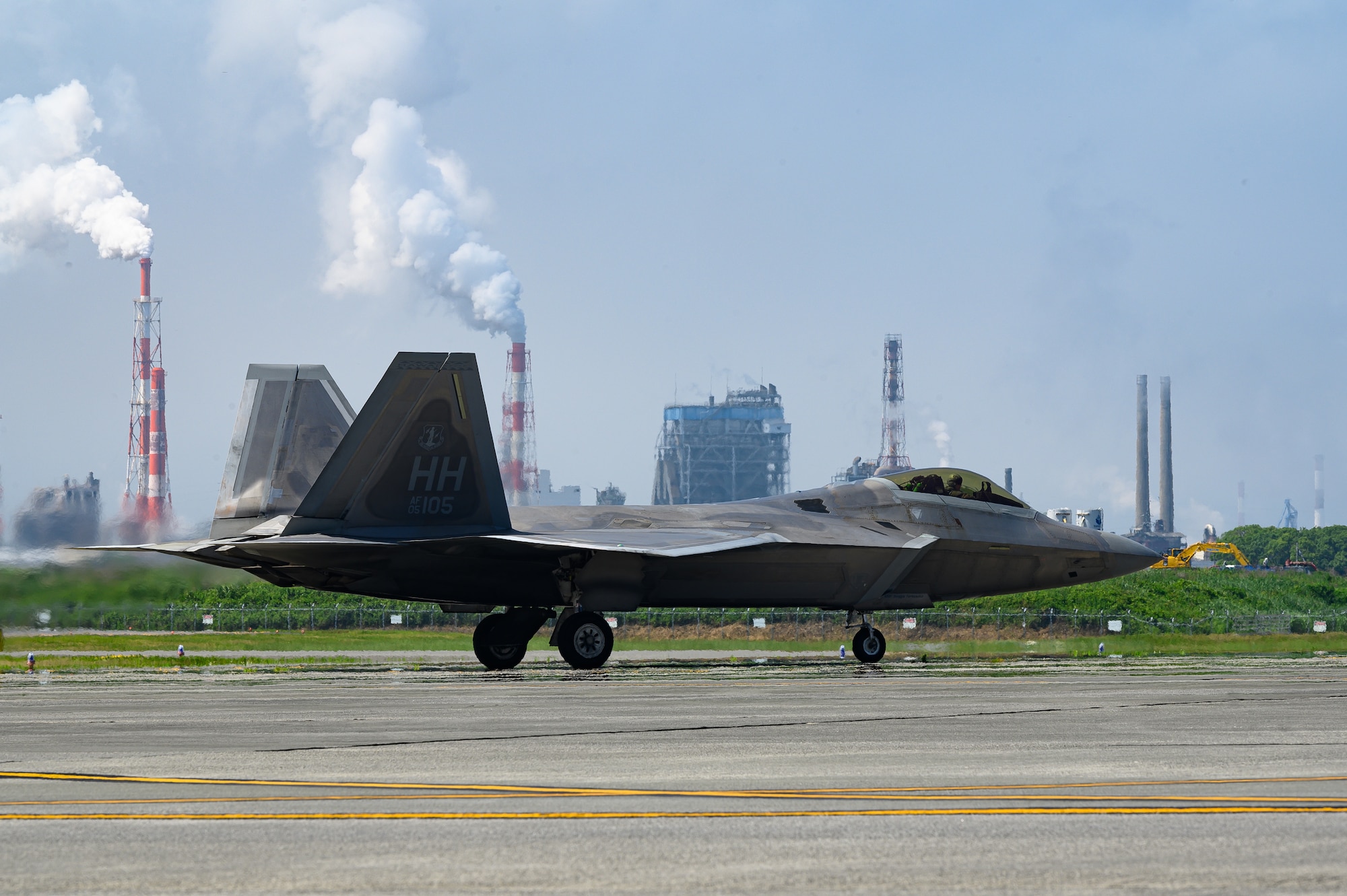A U.S. Air Force F-22 Raptor assigned to the 199th Expeditionary Fighter Squadron sits on the flightline during Agile Combat Employment training at Marine Corps Air Station Iwakuni, Japan, June 22, 2022.