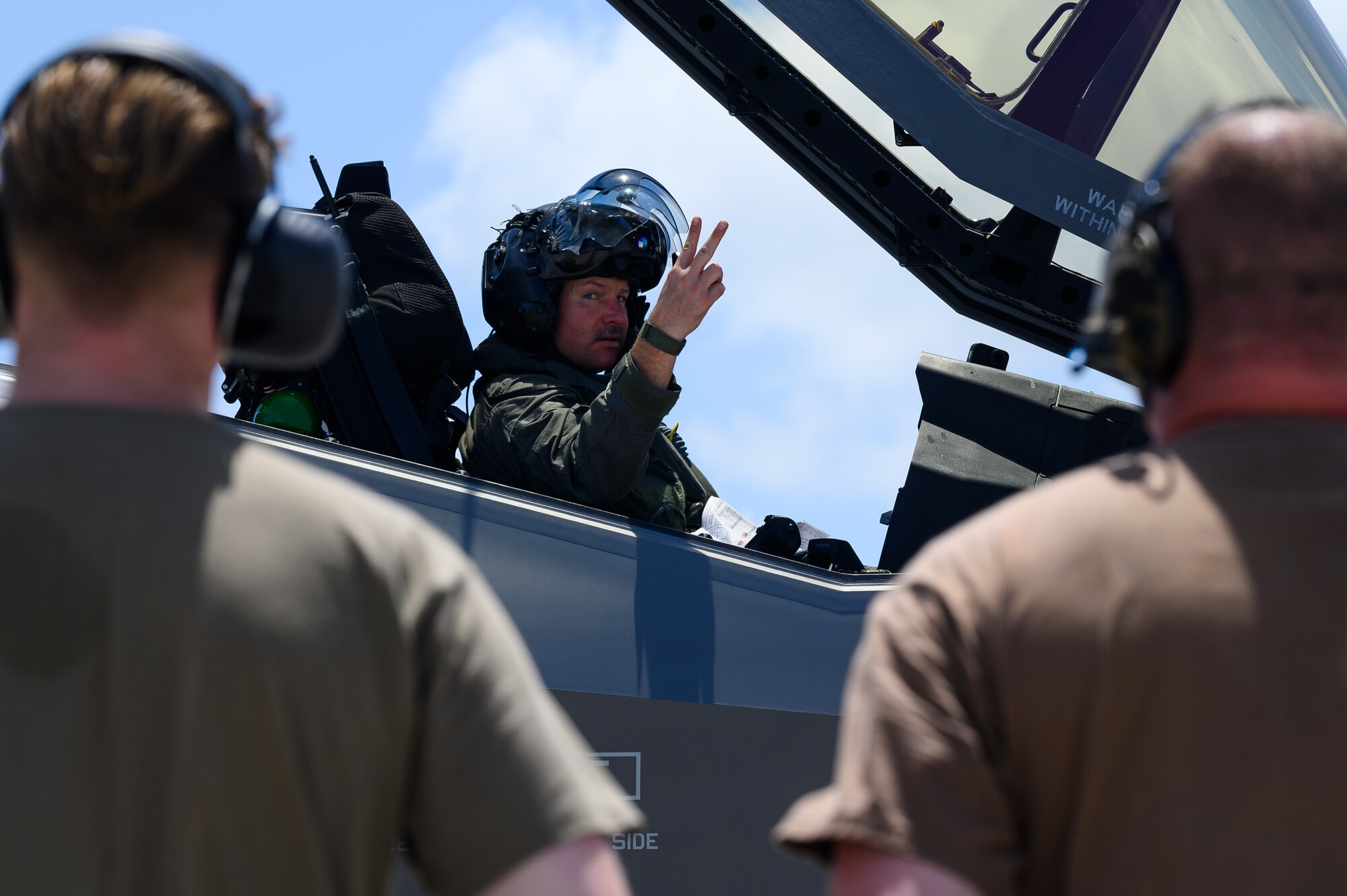 U.S. Air Force Col. David Berkland, the 354th Air Expeditionary Wing commander, and crew chiefs assigned to the 356th Expeditionary Fighter Squadron and 199th Expeditionary Fighter Squadron, conduct preflight operations during Agile Combat Employment training at Marine Corps Air Station Iwakuni, Japan, June 28, 2022.