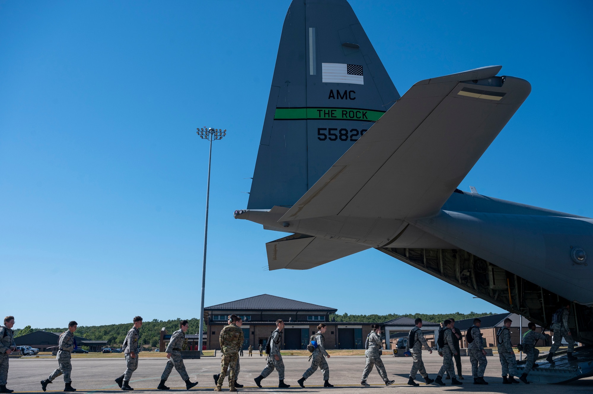 Civil Air Patrol cadets board a C-130J Super Hercules during a base visit