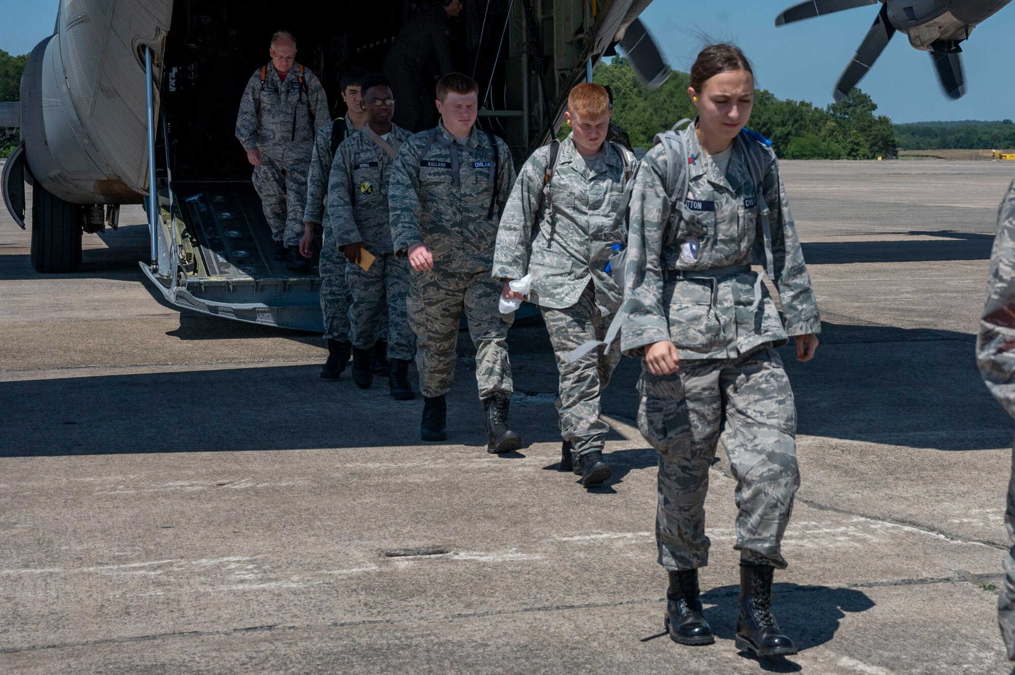 Civil Air Patrol cadets deboard a C-130J Super Hercules after an orientation flight