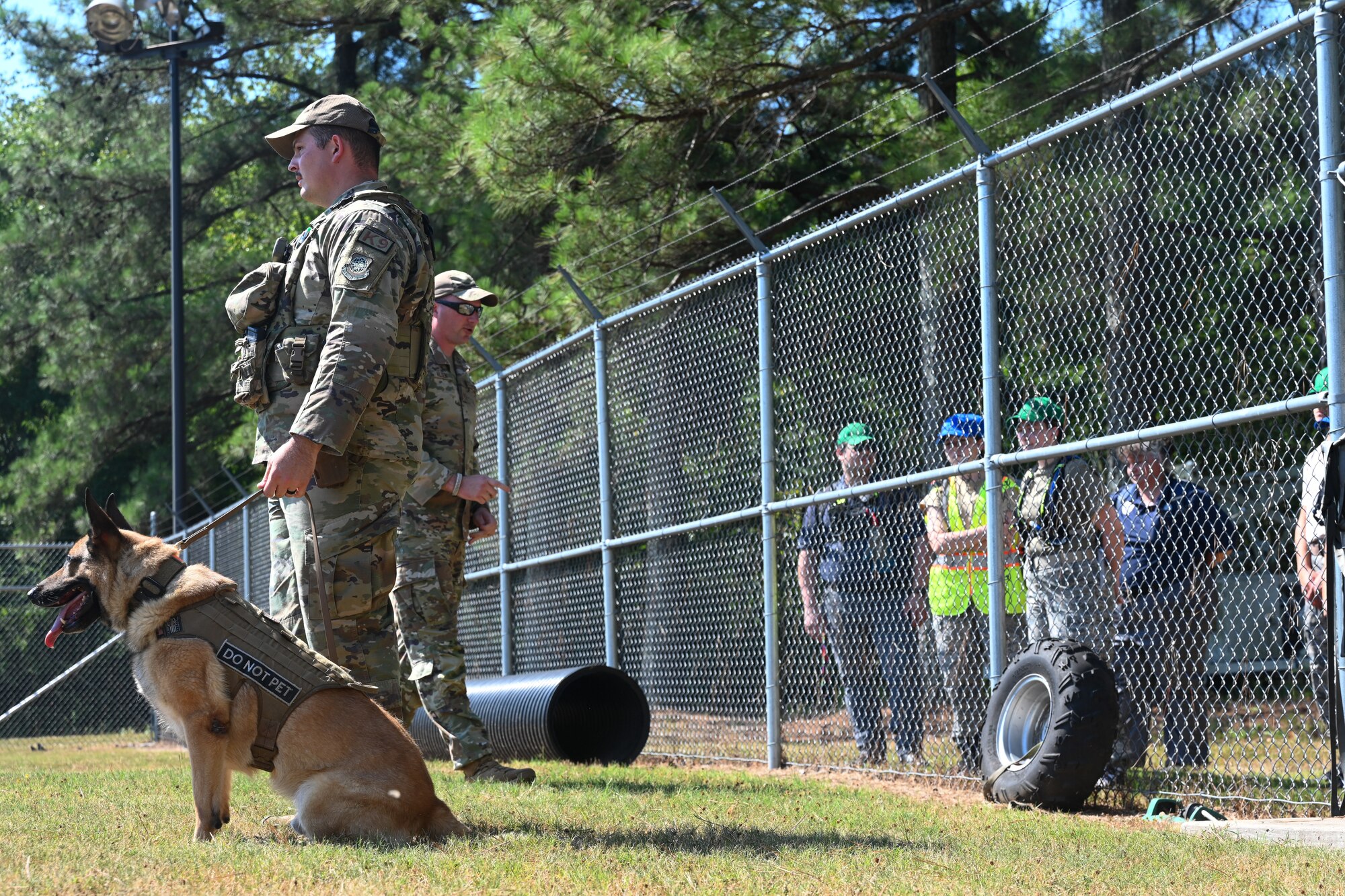 Civil Air Patrol cadets watch a military working dog demonstration during a base visit