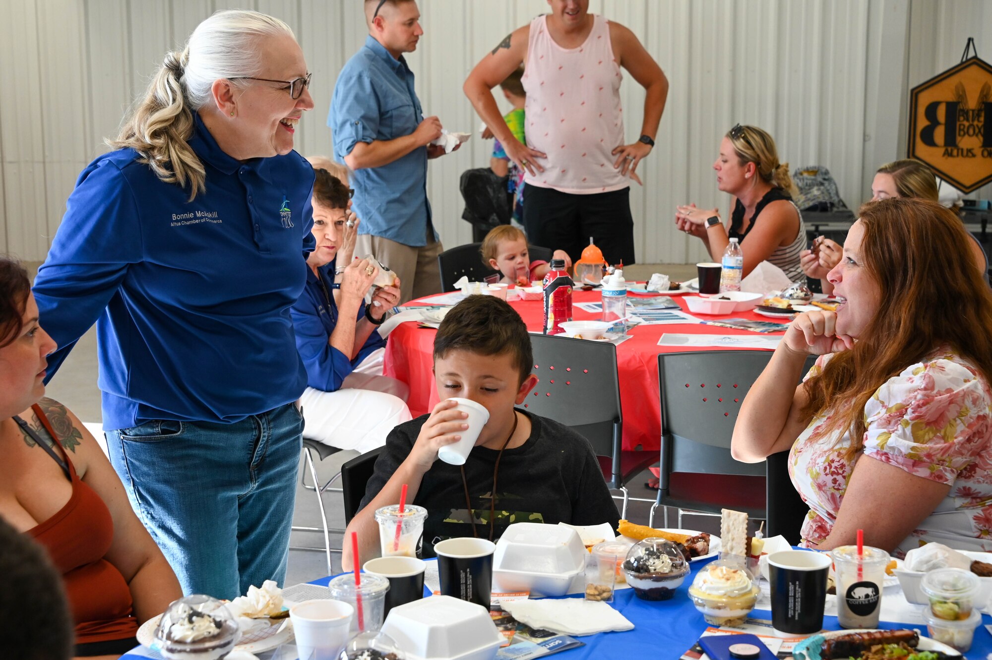 Bonnie McAskill, Committee of 100 member, talks with an Altus community member at the “Taste of Altus” event, July 11, 2022. The Committee of 100 hosts events throughout the year that integrate Airmen from Altus Air Force Base, Oklahoma, into the local community. (U.S. Air Force photo by Senior Airman Kayla Christenson)