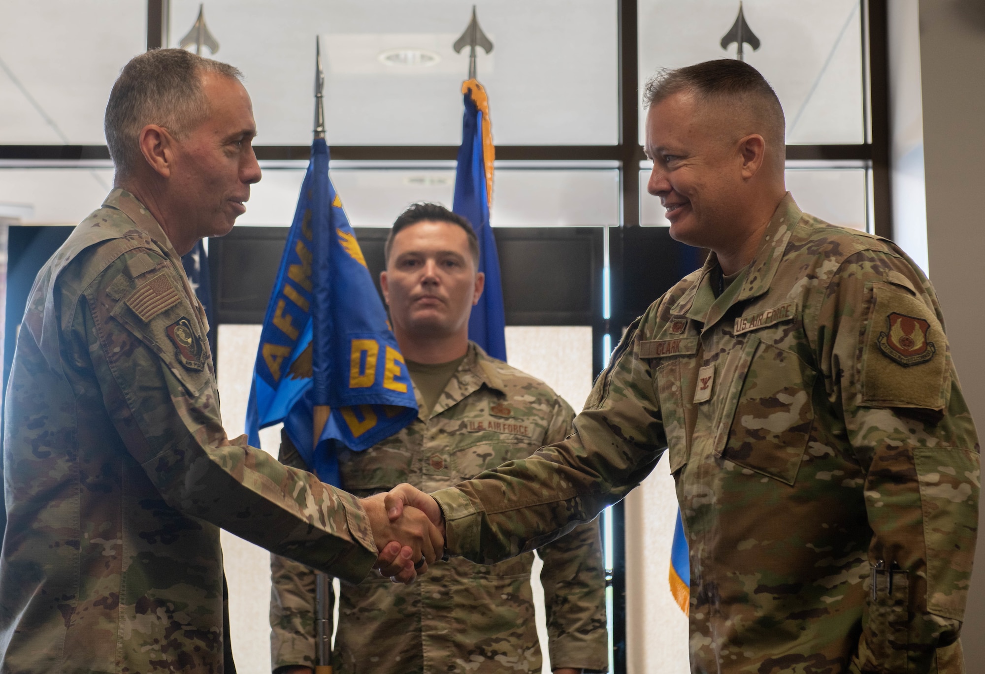 Airmen shake hands