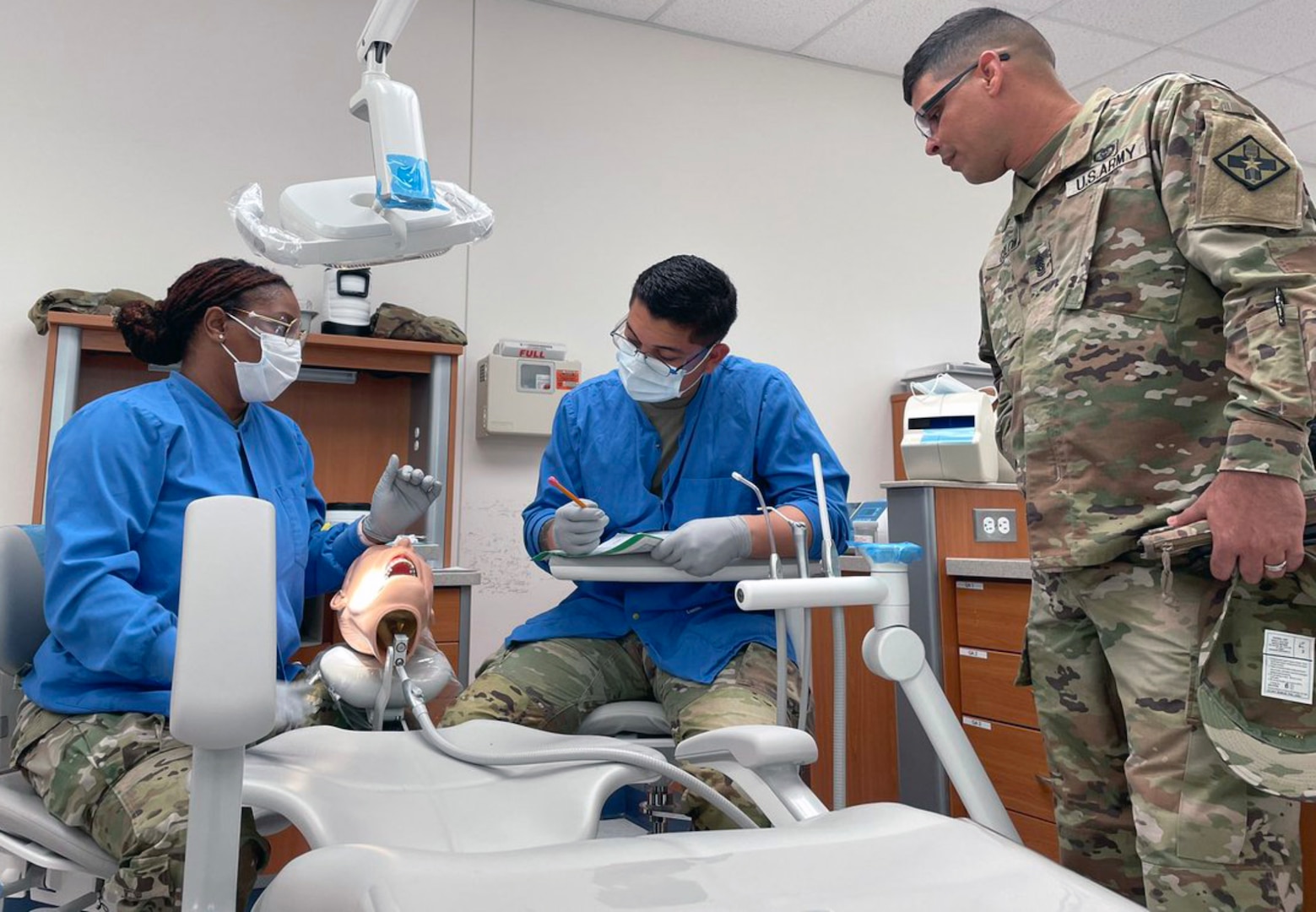 Dental students practice their skills while treating Soldiers, dependents, retirees