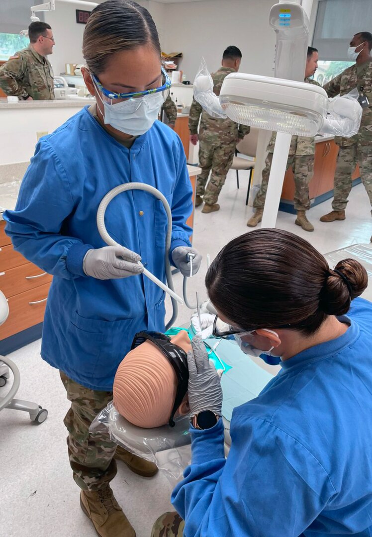 Dental students practice their skills while treating Soldiers, dependents, retirees