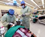 Dental students practice their skills while treating Soldiers, dependents, retirees