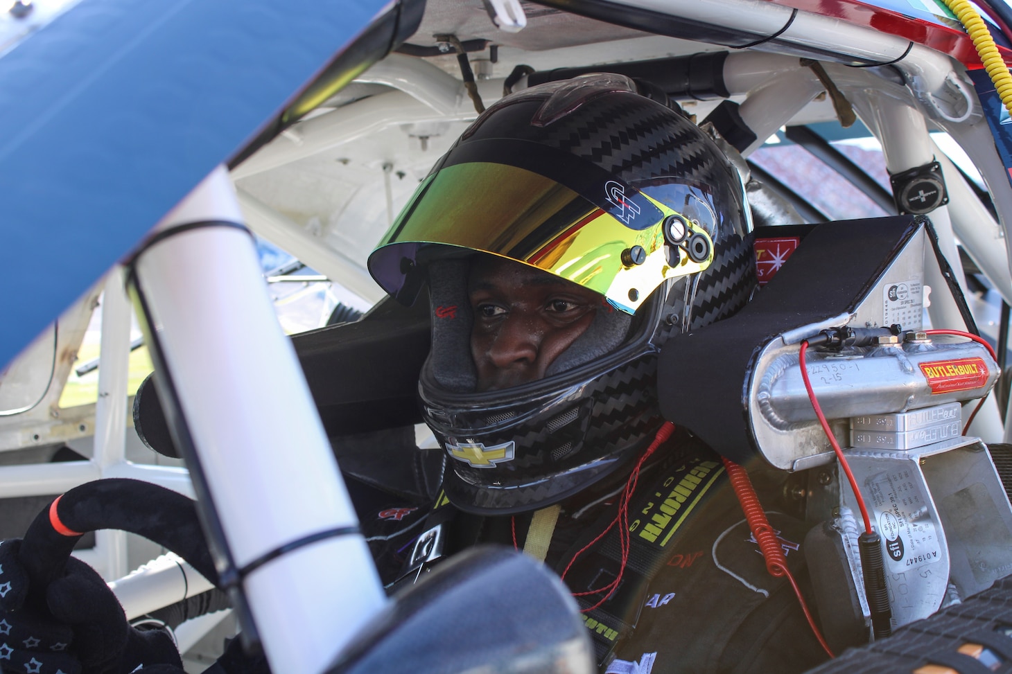 Navy Reserve Sailor and professional NASCAR driver, Lt. Cmdr. Jesse Iwuji, prepares to race at Talladega Superspeedway on Apr. 22, 2022.