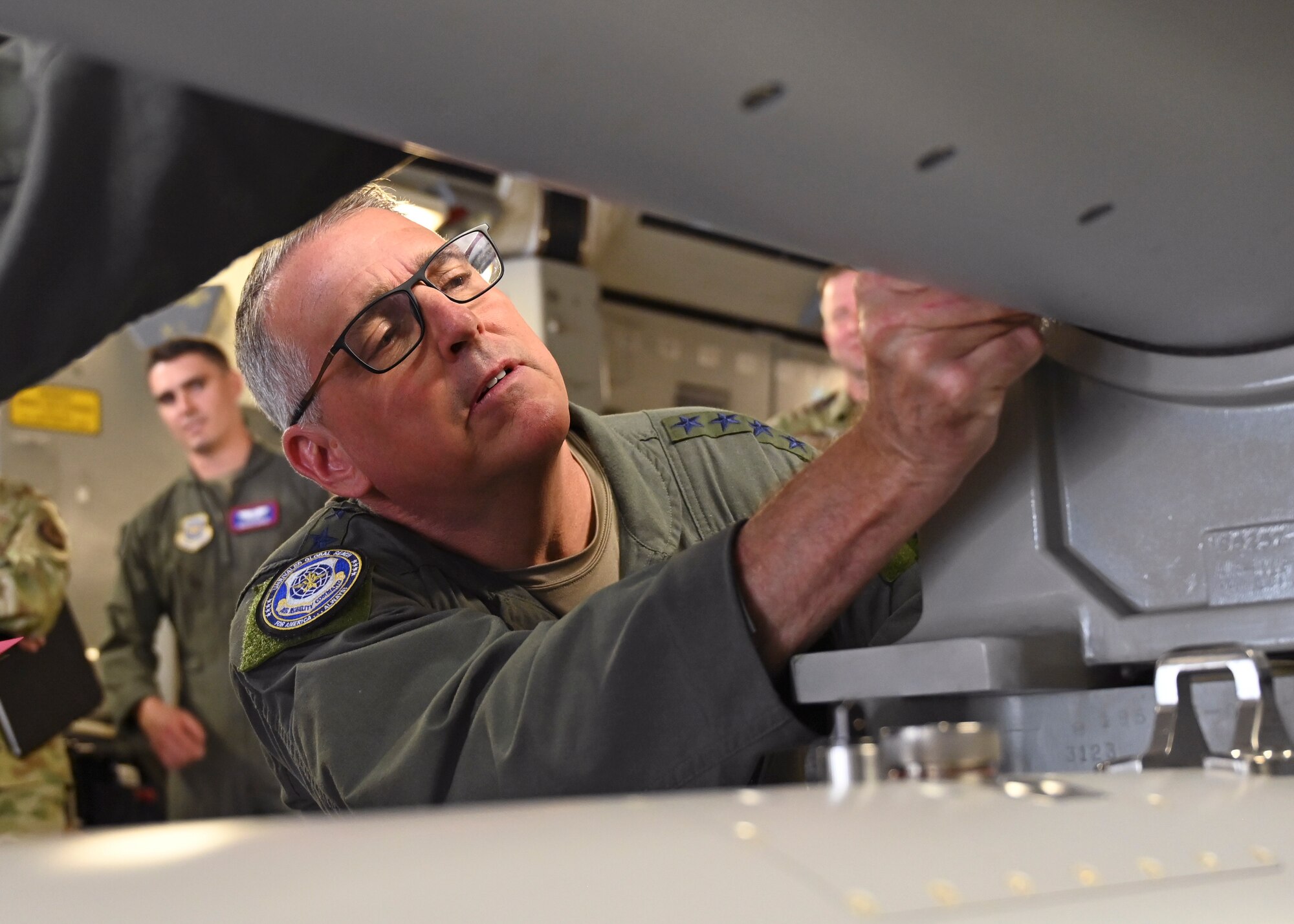 U.S. Air Force Gen. Mike Minihan, Air Mobility Command commander, disarms a weapon on a C-17 Globemaster III during his visit to Joint Base Lewis-McChord, Washington, July 7, 2022. Minihan and Chief Master Sgt. Brian Kruzelnick, AMC command chief, spent two days visiting Team McChord to experience the way America’s Airlift Wing executes rapid global mobility. (U.S. Air Force photo by Senior Airman Callie Norton)