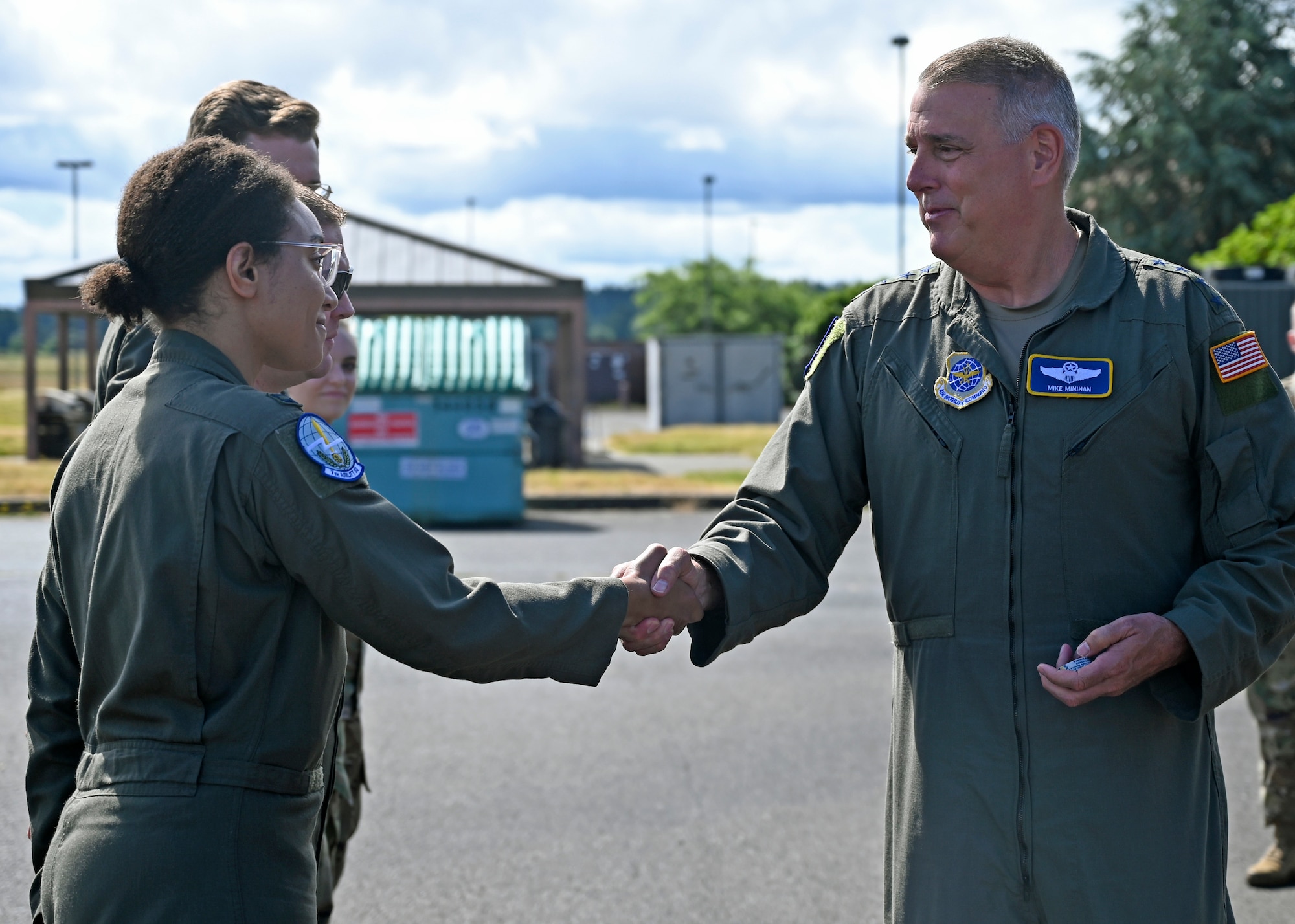 U.S. Air Force Gen. Mike Minihan, Air Mobility Command commander, coins the 2021 AMC Doolittle Award winners during his visit to Joint Base Lewis-McChord, Washington, July 7, 2022. The crew of RCH683 was recognized for their participation in Operation ALLIES REFUGE, which enabled thousands of Afghani’s evacuation from Kabul, Afghanistan, in August 2021. (U.S. Air Force photo by Senior Airman Callie Norton)