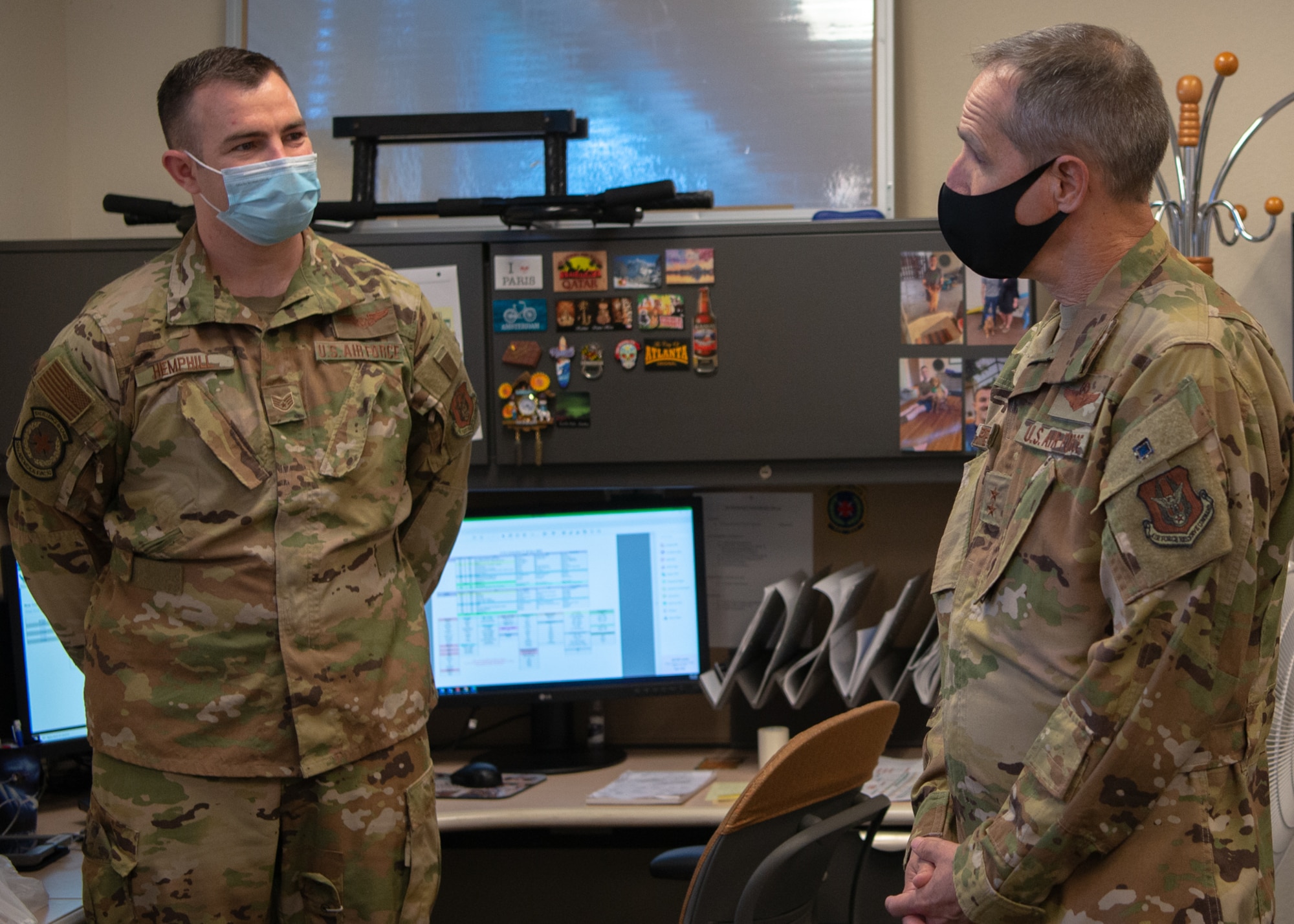 Maj. Gen. Jeffrey T. Pennington, 4th Air Force commander, receives a briefing from Staff Sgt. Brent Hemphill, 349th Aeromedical Evacuation Squadron technician during his visit July 9, 2022, at Travis Air Force Base, Calif.  The opportunity allowed the 349th Air Mobility Wing to showcase its people, mission, accomplishments, and innovation efforts