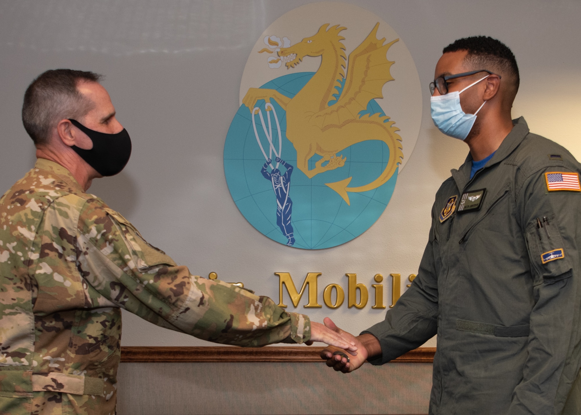 Maj. Gen. Jeffrey T. Pennington, 4th Air Force commander, coined 1st Lt. Jalen Anderson of the 301st Airlift Squadron during his visit July 10, 2022, at Travis Air Force Base, Calif.  The opportunity allowed the 349th Air Mobility Wing to showcase its people, mission, accomplishments, and innovation efforts.