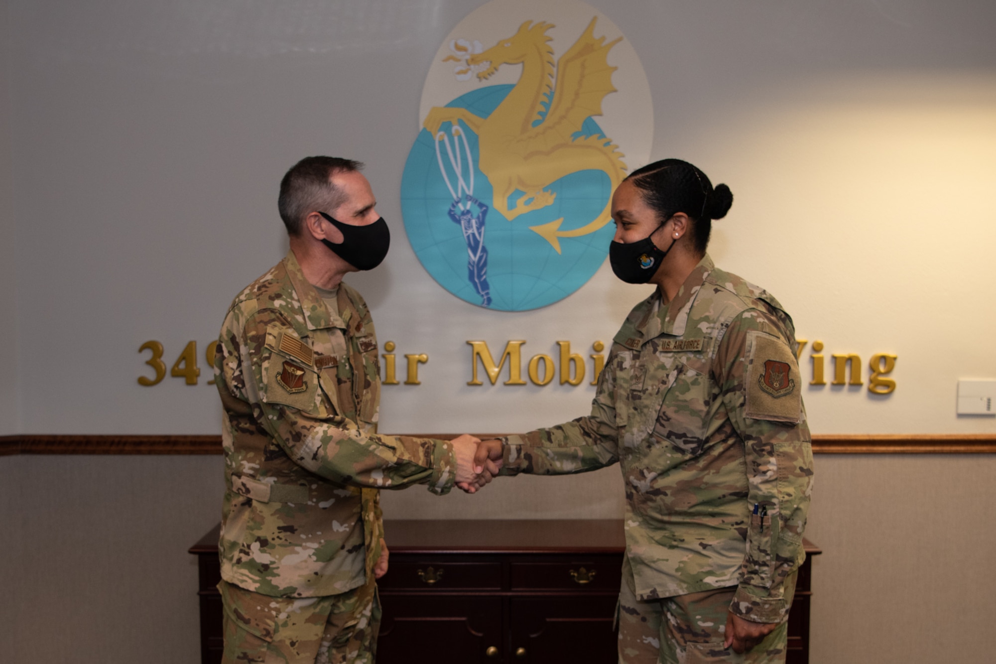 Maj. Gen. Jeffrey T. Pennington, 4th Air Force commander, coined Staff Sgt. Taylor Culler, 349th Air Mobility Wing  customer support liaison, during his visit July 10, 2022, at Travis Air Force Base, Calif.  The opportunity allowed the 349th AMW to showcase its people, mission, accomplishments, and innovation efforts.