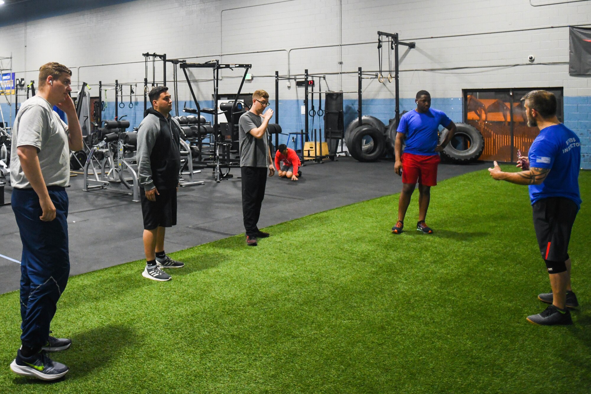 Brett Carbo, 75th Force Support Squadron training specialist, teaches airmen proper exercise discipline at the Hess Fitness Center on Hill Air Force Base.