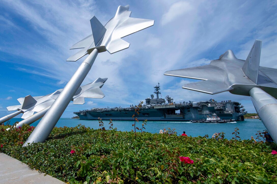 A ship seen through airplane statues.