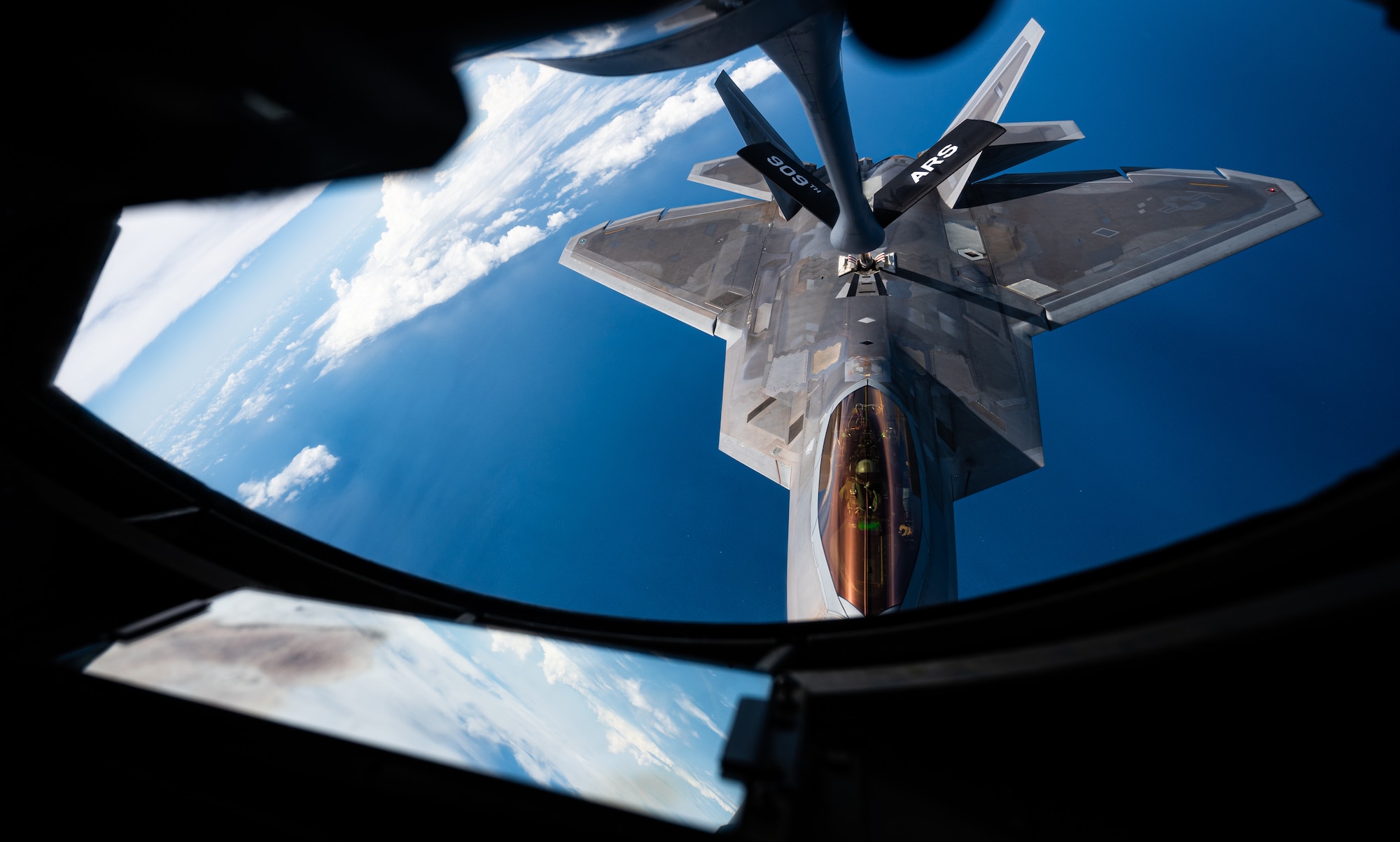 A plane flies in the sky.