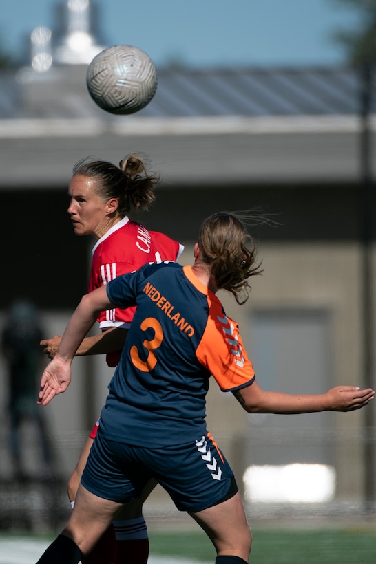 Canada’s Kim O’Rourke, back, and Emma Verdaasdon of Team Netherlands compete for a ball during the 13th CISM (International Military Sports Council) World Military Women’s Football Championship in Meade, Washington July 14, 2022. (DoD photo by EJ Hersom)